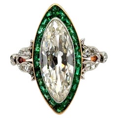 Bague Art déco en or jaune 18 carats, diamants et émeraudes