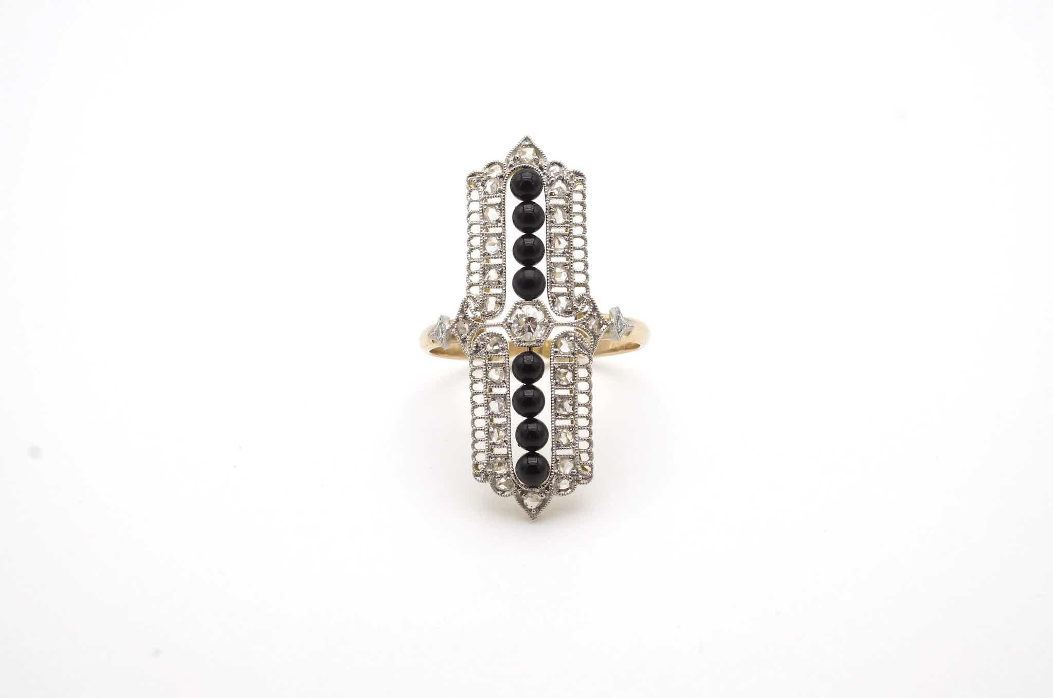 Stones: Onyx and rose-cut diamonds for a total weight of 0.20 carat
Material: Platinum and 18k yellow gold
Dimensions: 1cm x 3.2cm length on finger
Period: 1920
Weight: 4.5g
Size: 57 (free sizing)
Certificate
Ref. : 24718