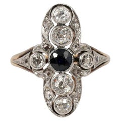 Art Deco Ring with Round Sapphire and Diamonds 0.70 ct.