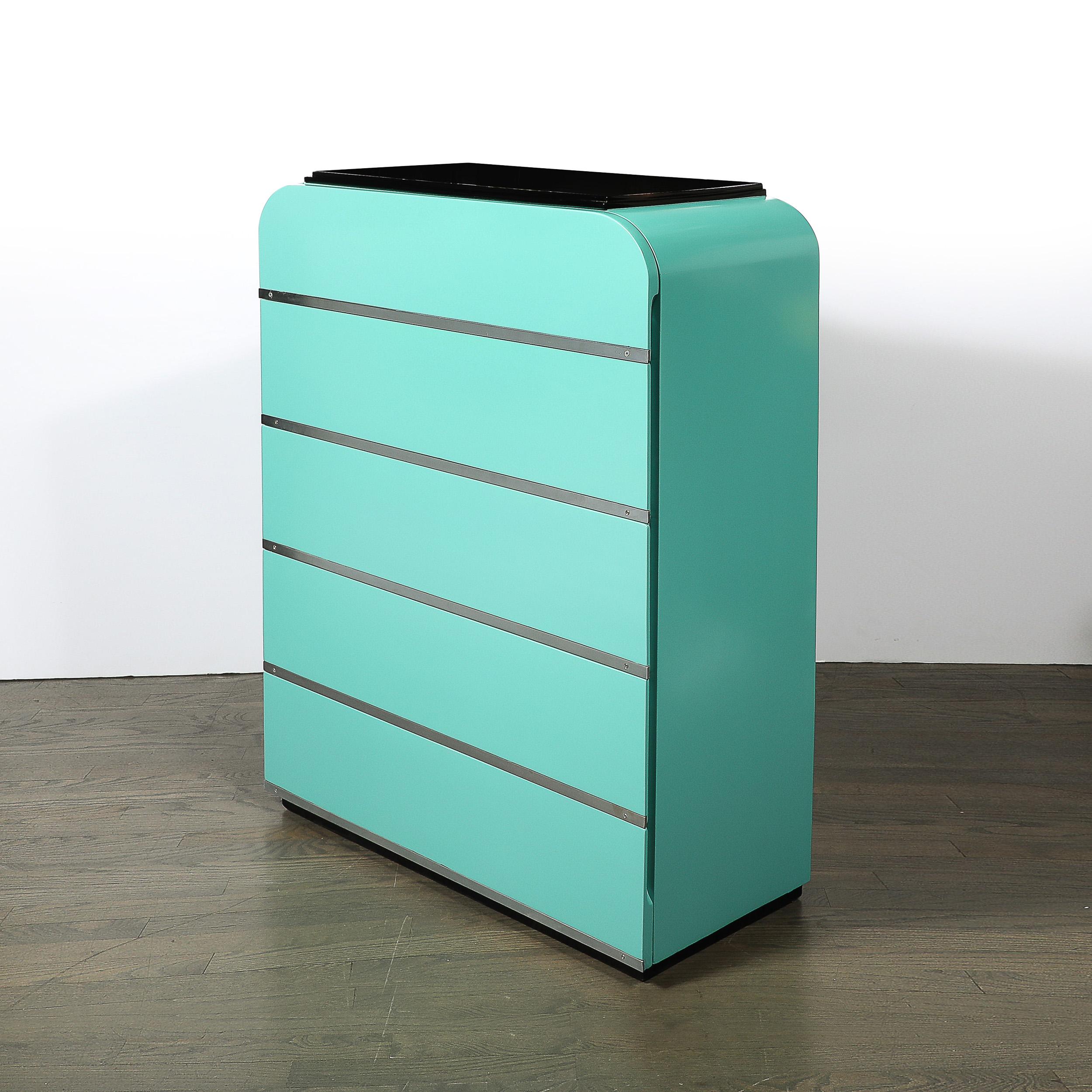 Enhance your interior with this iconic Art Deco Streamlined High Chest, designed by the illustrious Donald Deskey, circa 1930. This American-made piece exemplifies Deskey's signature style and the refined elegance of the Art Deco era, featuring a