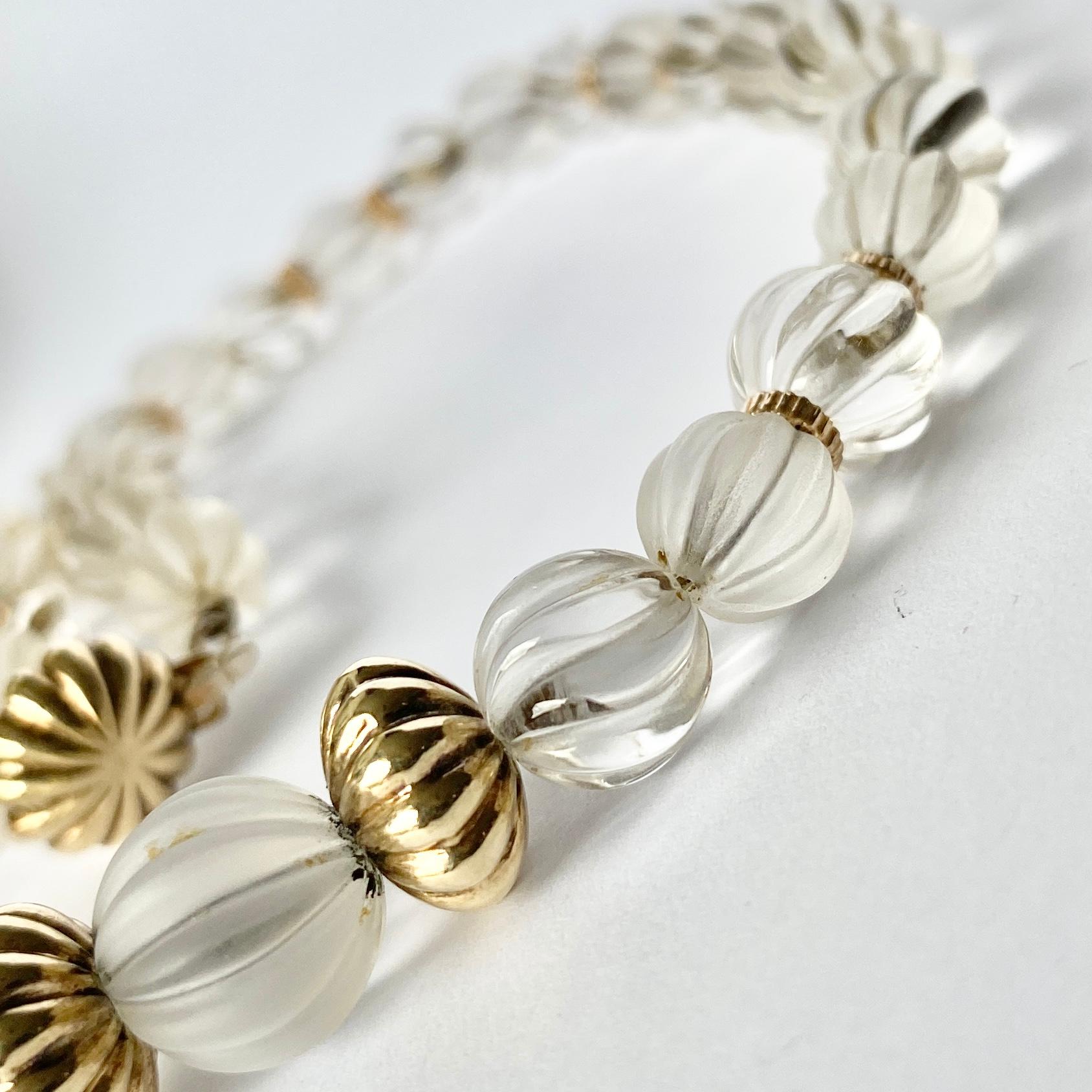 This gorgeous necklace is made of clear rock crystal with a matte effect and a shiny effect. The gold beads between are modelled in 9ct gold. 

Length: 43.5cm
Bead Diameter: 8-14mm

Weight: 38.2g