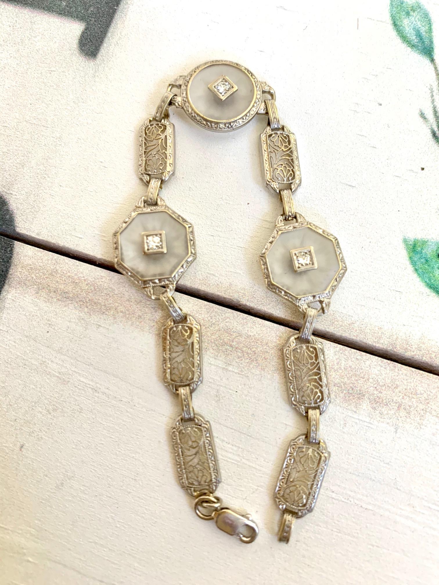 These beautiful Art Deco Camphor Glass  and Diamond Filigree bracelet is set in 14k white and yellow Gold.  Each piece of Camphor Glass  (3) features a Diamond center.  

Length: 7