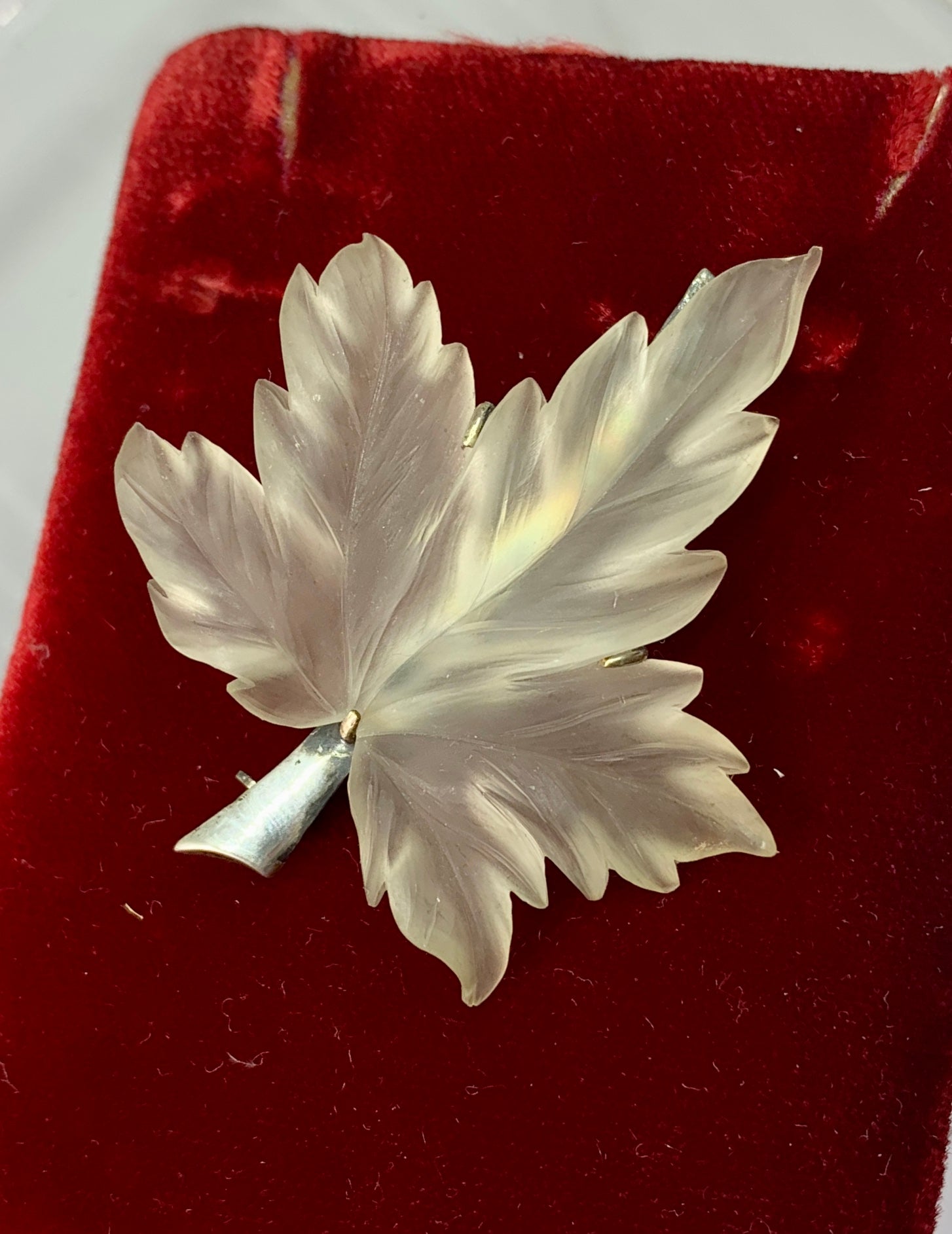 This is a stunning antique Art Deco Rock Crystal Leaf Brooch Pin with a magnificent carved Rock Crystal Leaf in Sterling Silver and carved by the superb lapidary artists in Idar Oberstein Germany.  The extremely fine life size leaf is a masterpiece