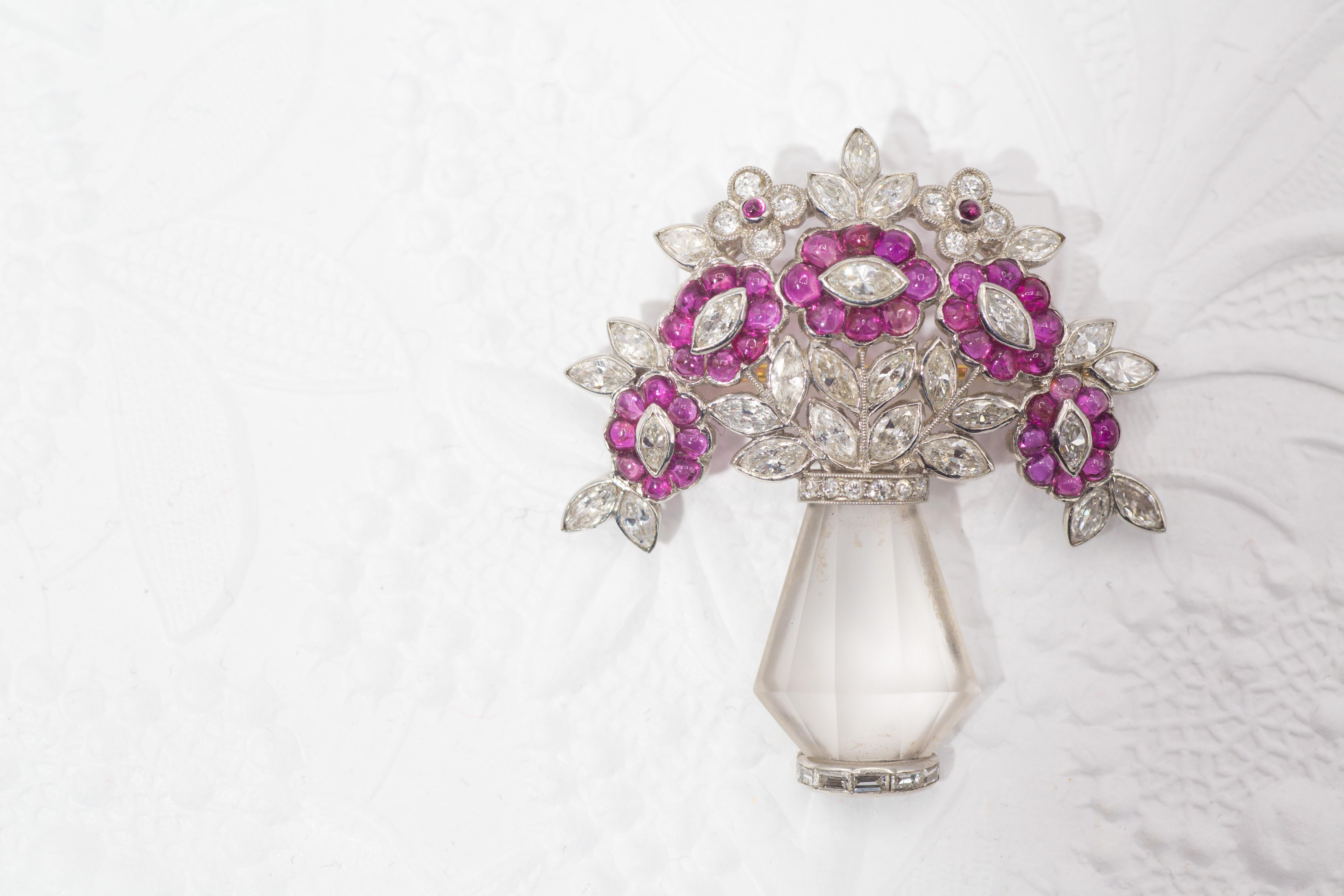 Unique Art Deco brooch from ca. 1930 in the form of a flower bouquet within a crystal vase. Amazingly well hand-crafted and beautifully designed, the brooch has been worked in platinum with Old European cut and old cut marquis shaped diamonds,