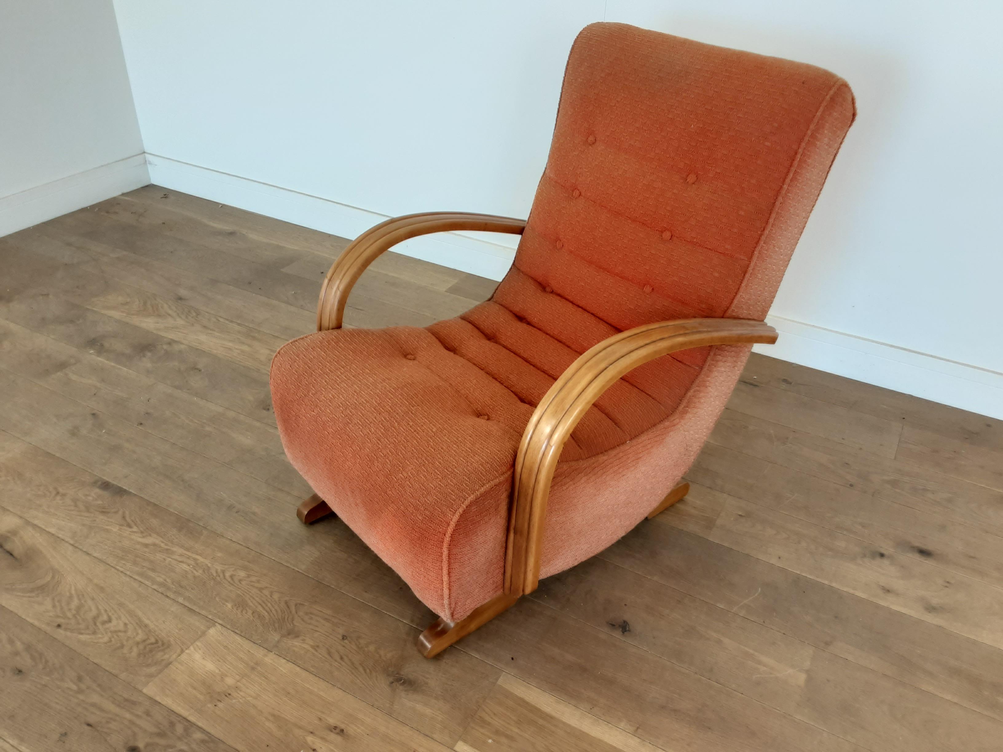 Art Deco rocking armchair.
Open arm armchair with rocking mechanism, the wooden arms nicely shaped and tooled grove running through.
Measures: 89 cm H 68 cm W 83 cm D
British circa 1930.