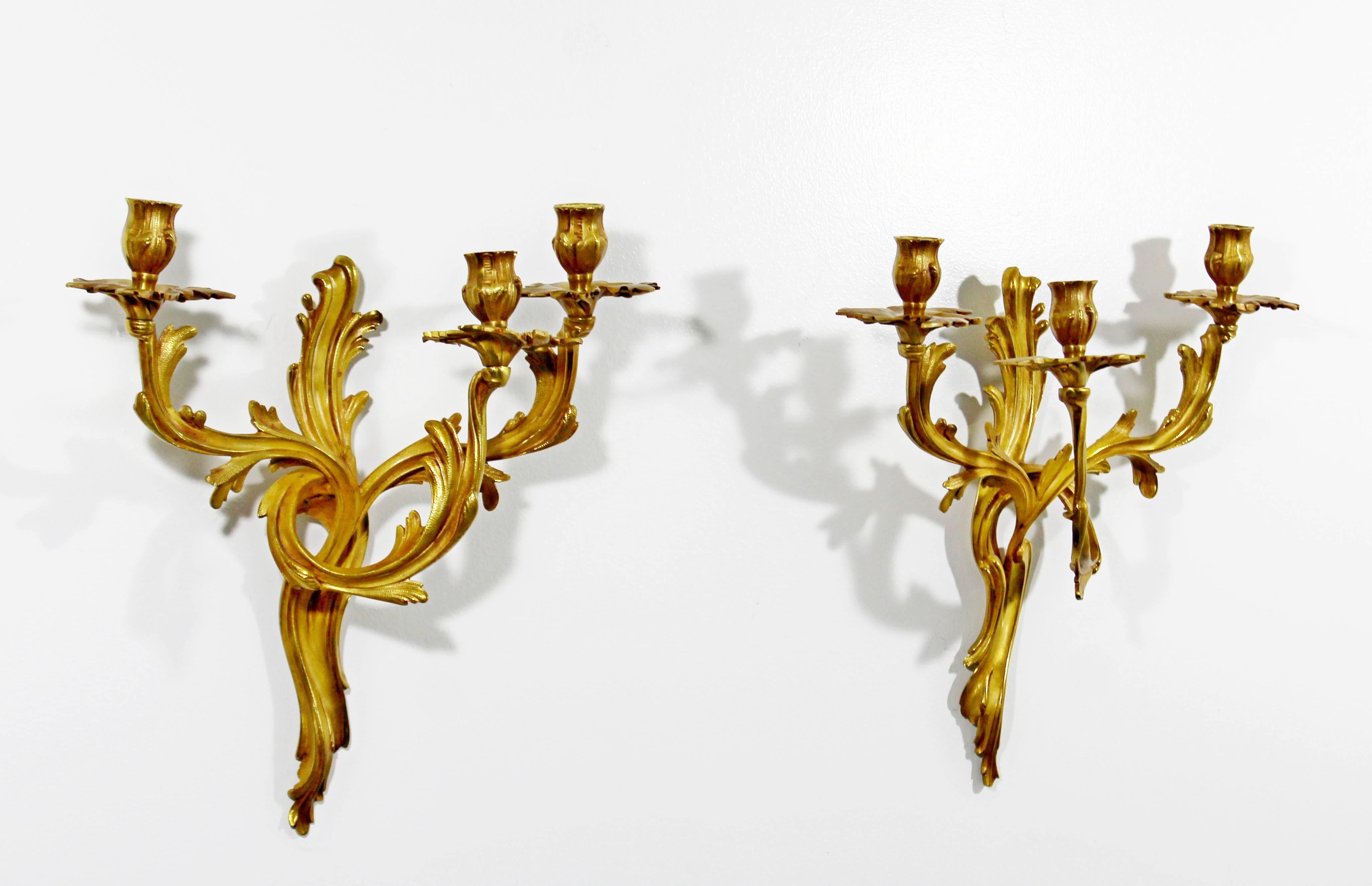 For your consideration is a beautiful, Rococo pair of gold gilt bronze wall sconces, Louis XV style. In excellent condition. The dimensions of each are 14.5