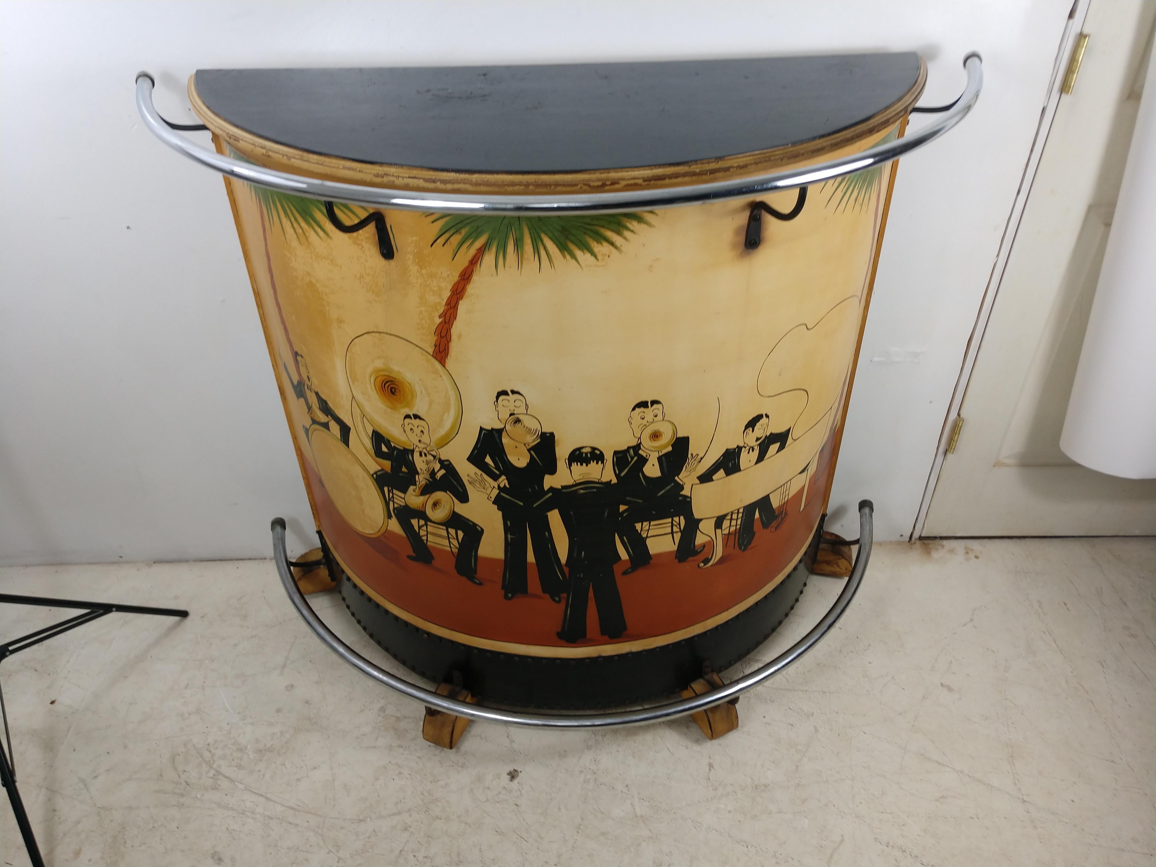 Fabulous and amazing, one of a kind demilune Art Deco period bar with a hand painted big band wailing away. Entirely original with nickel over brass tube hand and foot rail. Black bakelite toe kick panel and a fitted back bar for bottles and