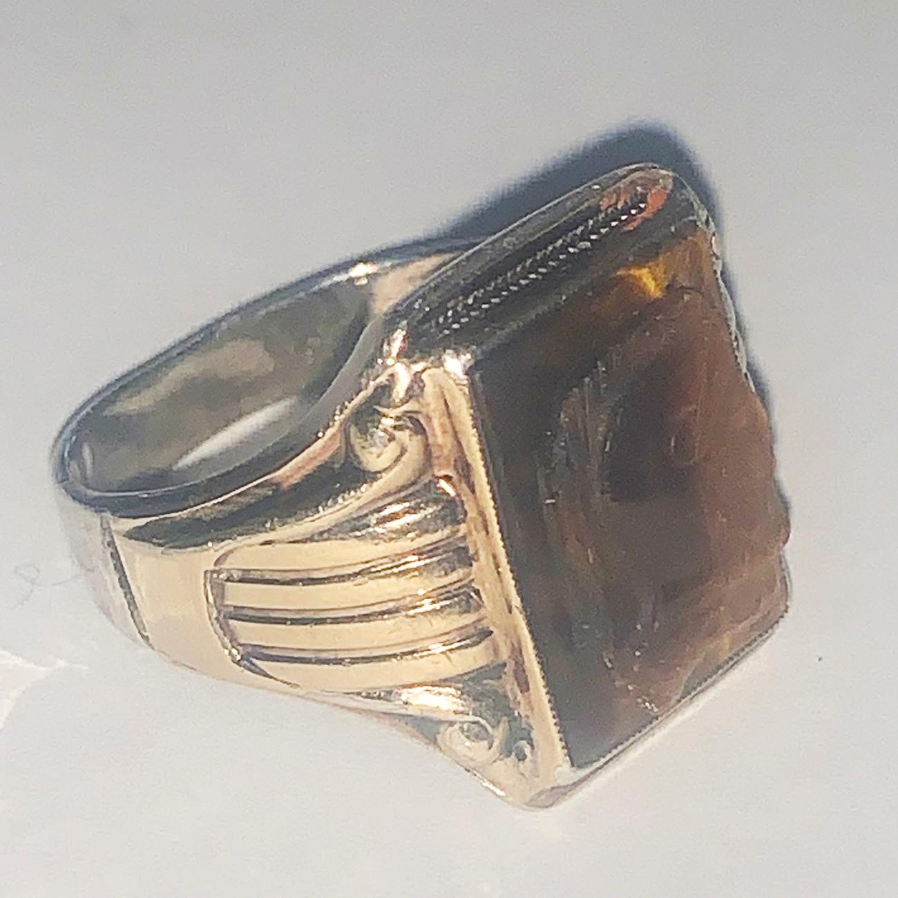 Art Deco Signet Ring Roman Carved Tiger Eye set to 10ct Gold on Sterling Silver rear. Fine detail of a Roman Centurion to the Tiger Eye gem stone, and Hallmarked to the Rear “STERLING” over “10K GOLD TOP” indicating USA origin. Excellent condition