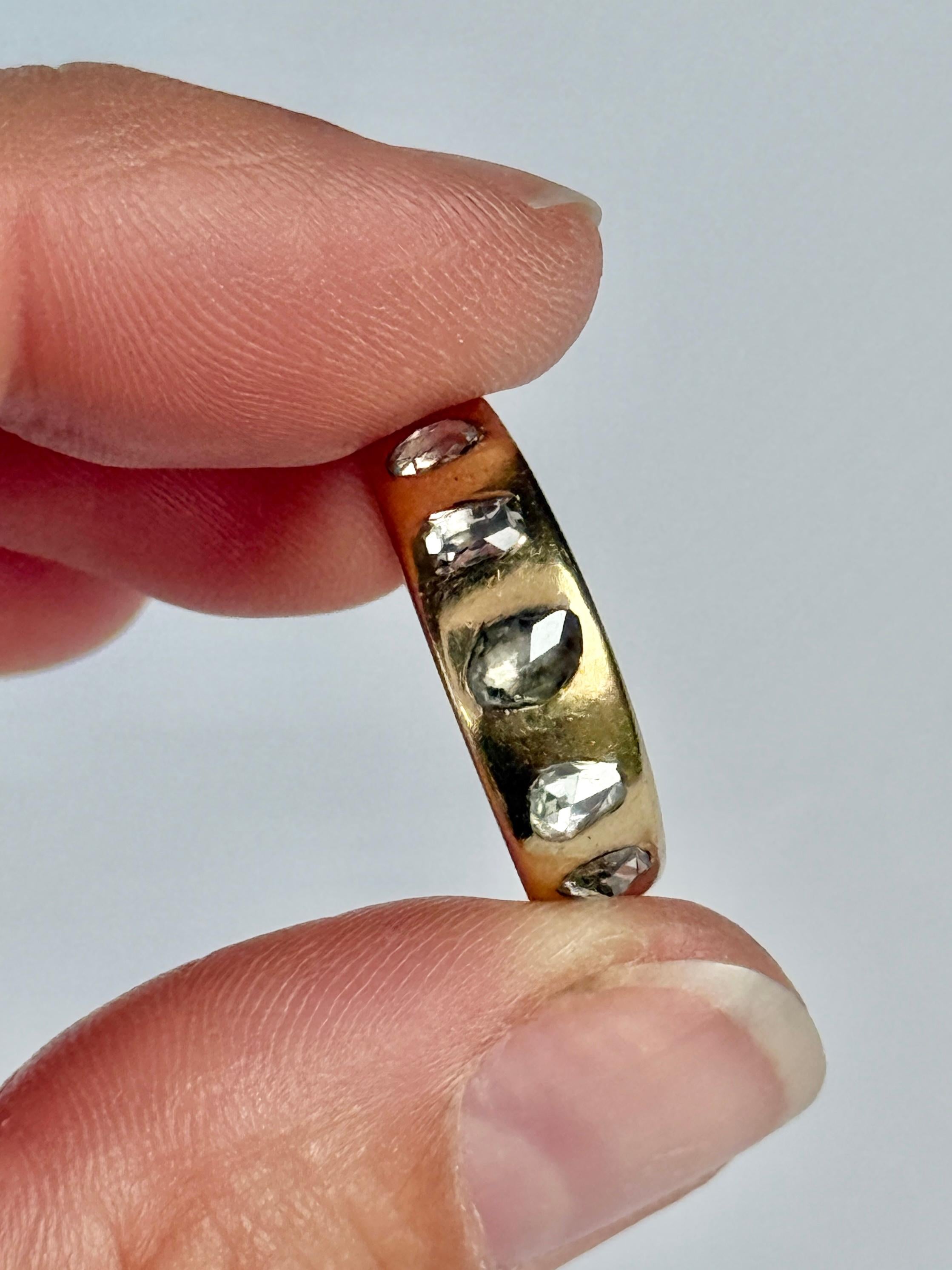 This ring is modelled in 18 carat gold and the rose cut diamonds are set in platinum. The total diamond weight of this ring is approx 55pts.

Ring Size: L 1/2 or 6 
Band Width: 6mm

Weight: 5.6g