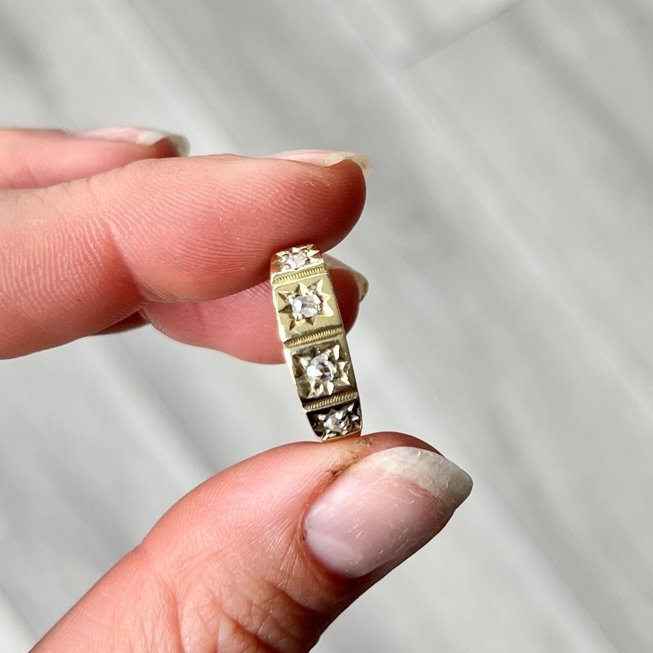 This gorgeous 18ct gold band holds four rose cut diamonds totalling 24pts. They are bright and have a lovely sparkle and are set in star settings. 

Ring Size: P 1/2 or 8 
Band Width: 5.5mm 

Weight: 2.5g