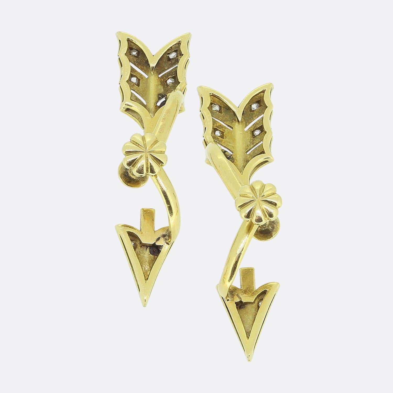 Here we have a delightful pair of earrings taken from the early stages of the 20th century. Each identical piece has been crafted from 18ct yellow gold into the shape of an arrow motif and adorned platinum set rose-cut diamonds. The design showcases