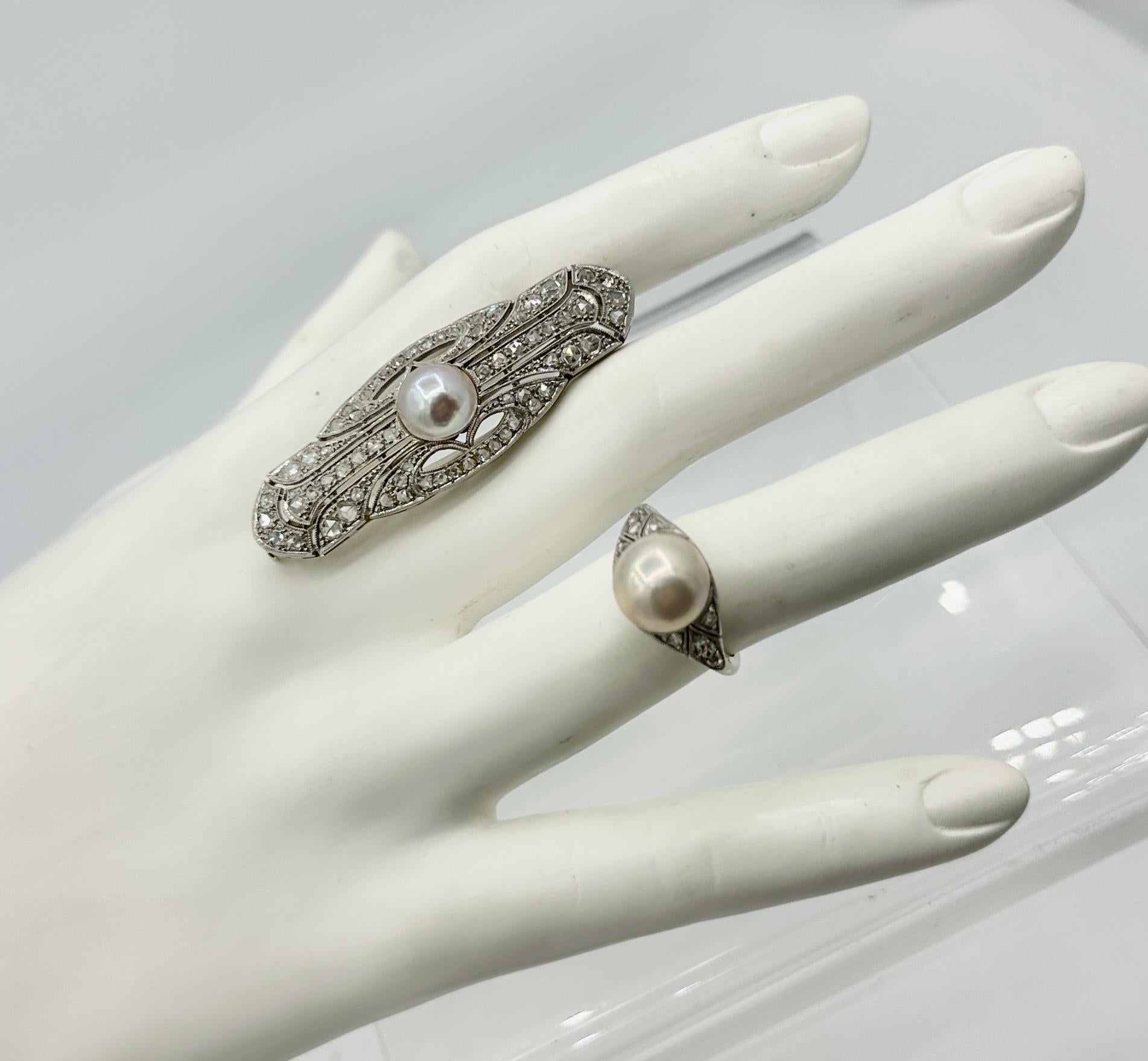 Indulge in a magnificent Pearl and Rose Cut Diamond Antique Victorian - Art Deco Wedding Engagement Ring parure with matching Ring and Brooch Pin in 18 Karat White Gold.   
The magnificent ring is set with a central White Pearl of 10mm in diameter. 