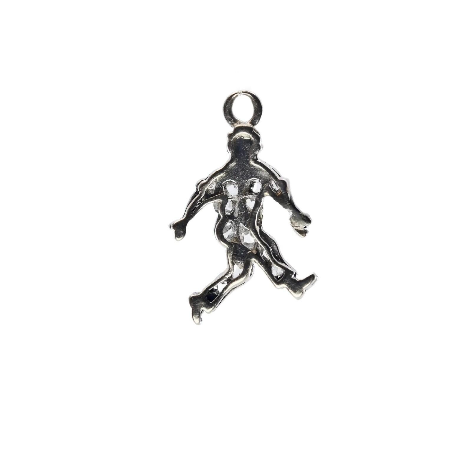 A handmade Art Deco period pave diamond walking man charm in platinum. Set with thirteen rose cut diamonds weighing a combined 0.15 carats and grading as H color, VS2 clarity. Beautifully hand crafted this wonderfully detailed charm measures just