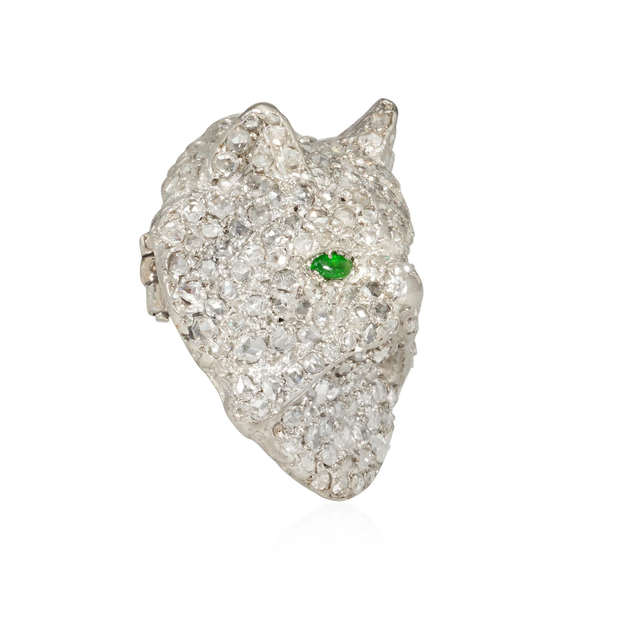 An Art Deco rose-cut diamond brooch in the form of a sculpted cat's head with cabochon emerald eyes, in platinum.

* Includes letter of authenticity for insurance purposes
* Free shipping
* Please do not hesitate to request additional photos of