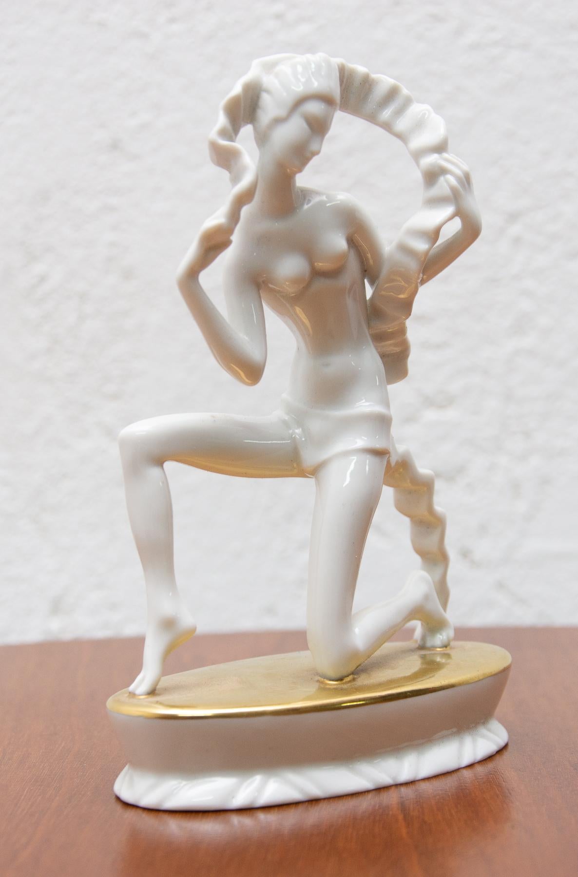 This rare sculpture was designed by Lothar Otto (1893-1970) and made by the world-famous Rosenthal porcelain factory in Germany. Depicts a naked kneeling girl - dancer. The statuette shows some abstraction elements. It is in excellent condition