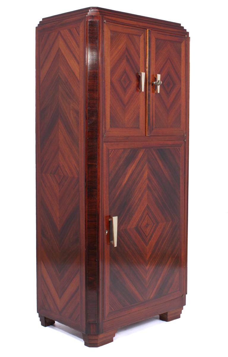 Art Deco rosewood cocktail cabinet.
An Art Deco period cocktail cabinet produced by Paris maker in the 1930s in France, it has two lockable cupboards the lower having shelves and the upper is satin birch lined with mirrors, the cabinet has been