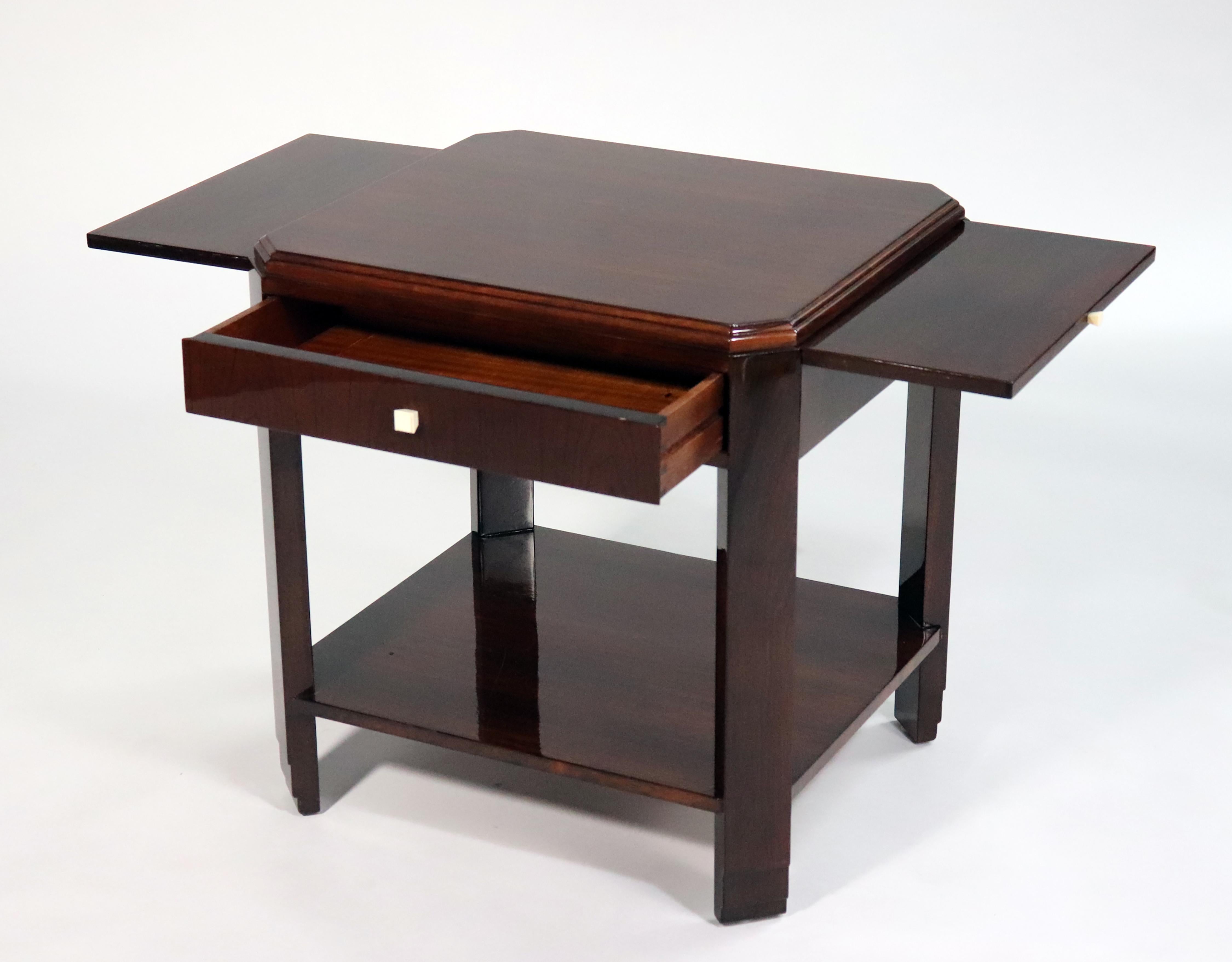 Art Deco side table table by Decoration Interieure Modernes (DIM) made out of rosewood with two small drawers.
Made in France
Circa: 1925.