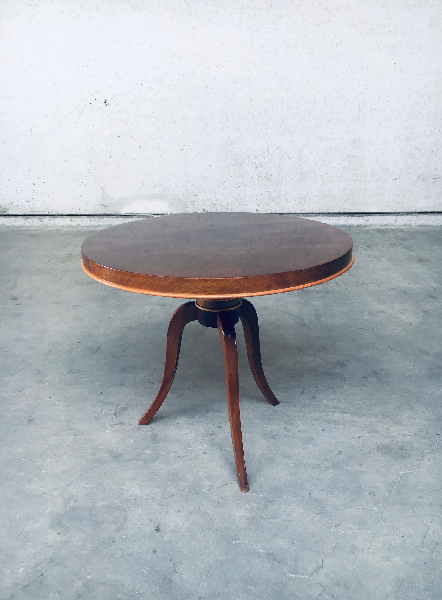 Vintage Art Deco Tripod Round Side Table in Rosewood, made in France 1930's. Parquetry quadrifoil top in rosewood with beech wood trim. Solid rosewood tripod feet with beech wooden trims. In very good, original condition. Measures 62cm x 71cm x 71cm.