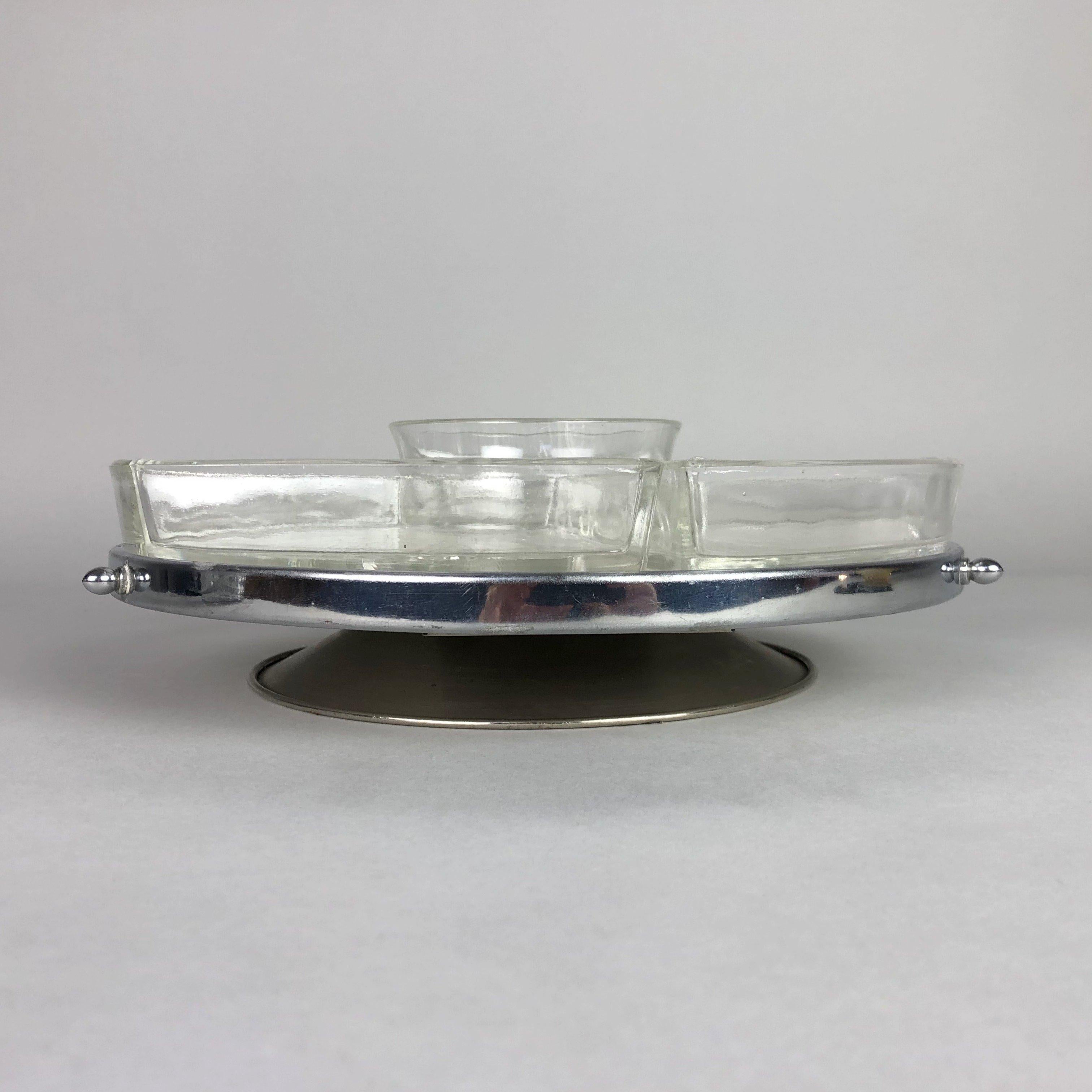 Art Deco rotating 'Lazy Susan' tray. There are 4 glass containers and one round bowl in the middle. If you remove all the glass, you can use it as a cake platter. Good vintage condition, there are just some scratches in the silver part of the