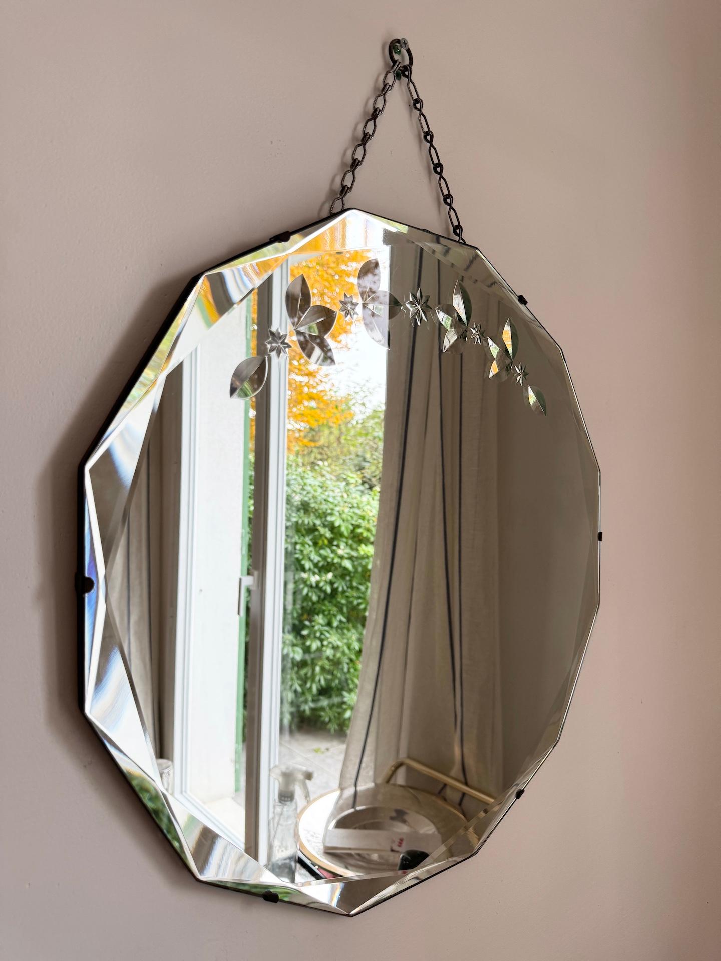 Art Deco Round Beveled Mirror with twelve sides measuring 51 cm diameter. 

This 12-sided dodecagon mirror is beveled all along the edge in the form of large and small triangular flat areas. A beautiful technique creating interesting reflections. It