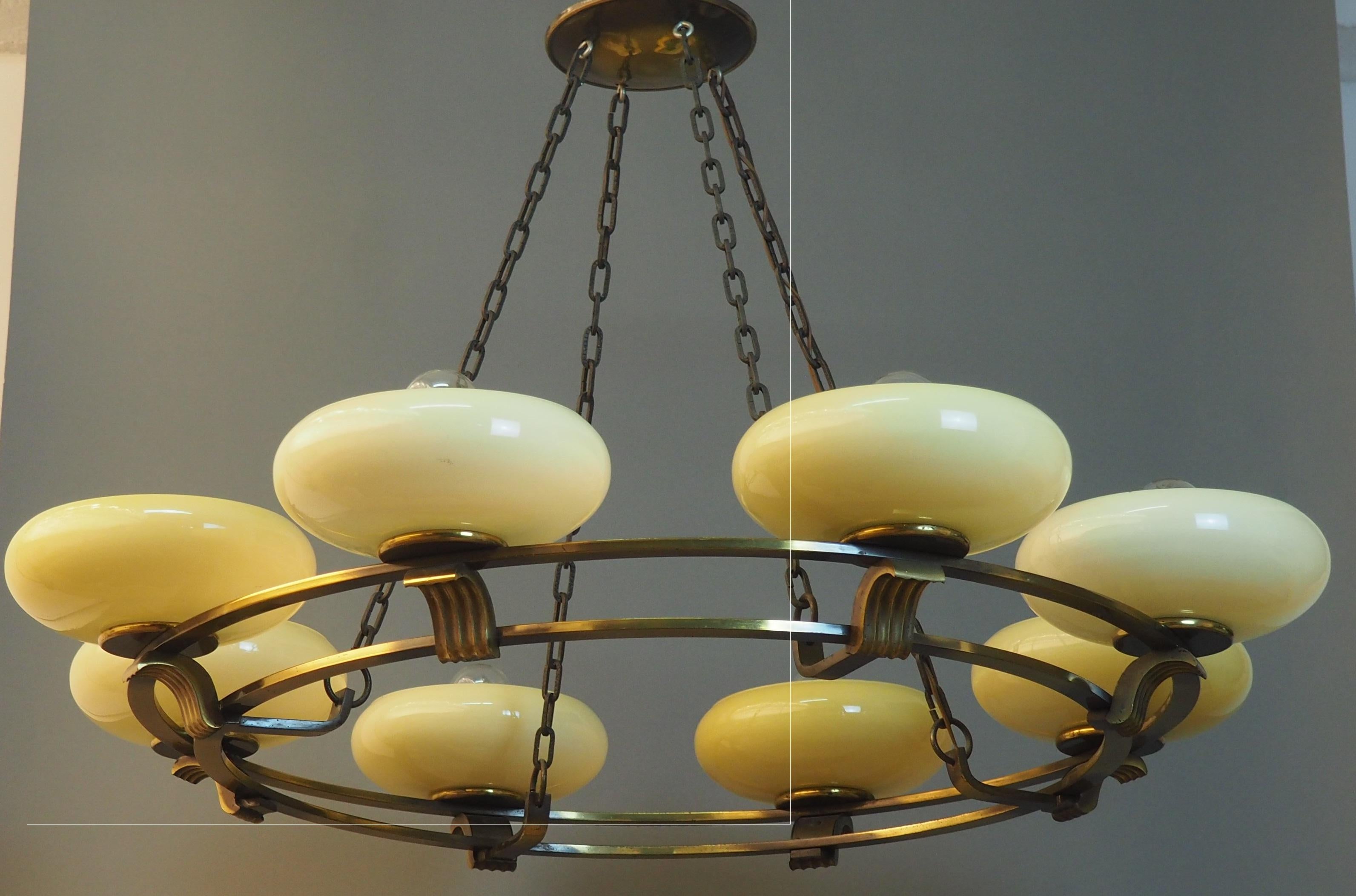 A stunning, round eight - light Art Deco brass and opal glass chandelier attributed to Kaiser, Germany, circa 1930s-1940s.
Socket: 8 x e27 for standard screw bulbs.

 
