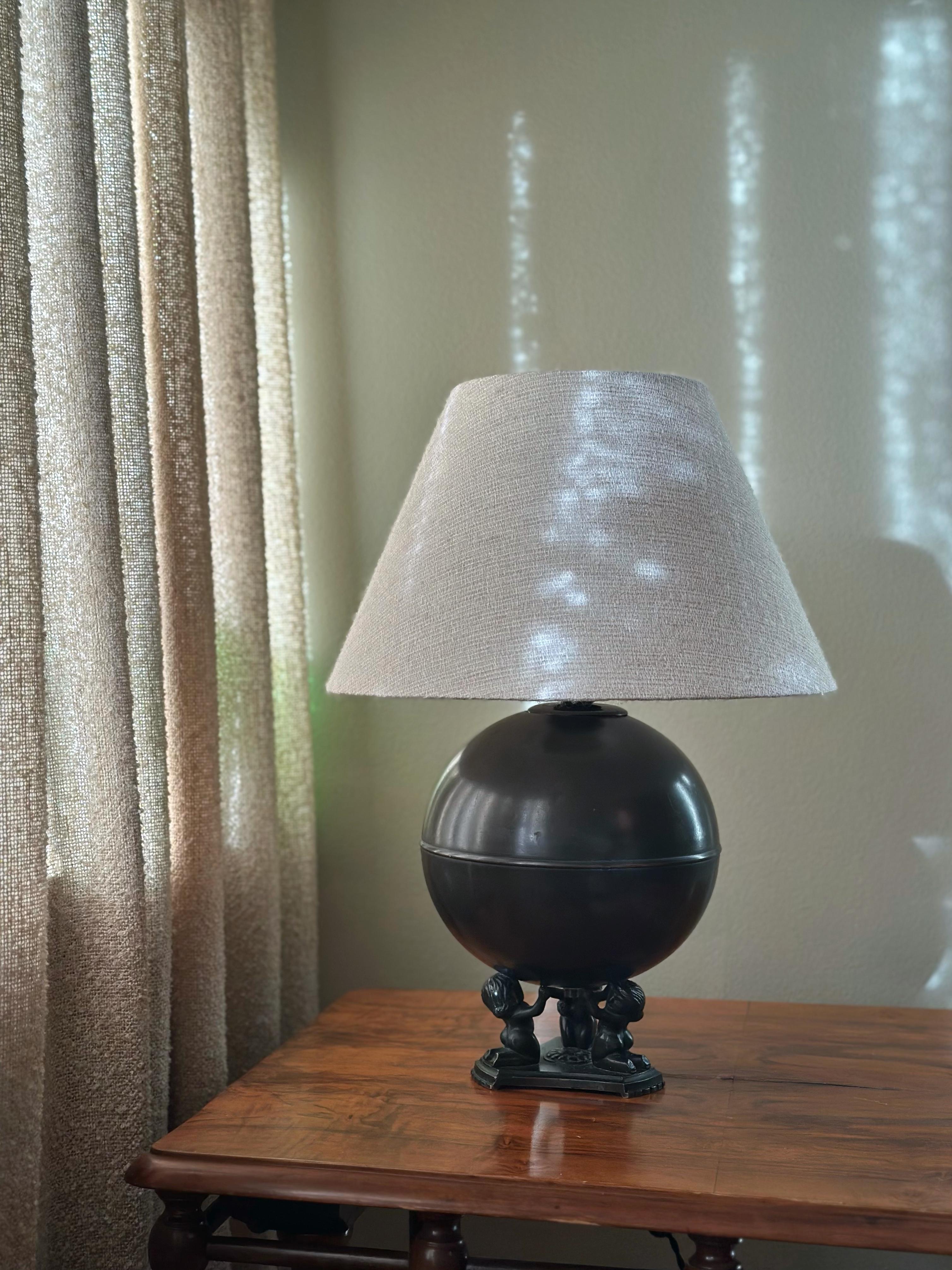 Elegant Swedish Art Deco Bronze Table Lamp with distinctive feet in patinated bronze. The Large Round Bronze Table Lamp is designed by NILSSON & JOHANSSON for Äkta Brons Svensk Vara, produced in the 1930’s.

Bronze Table Lamp with a round spherical