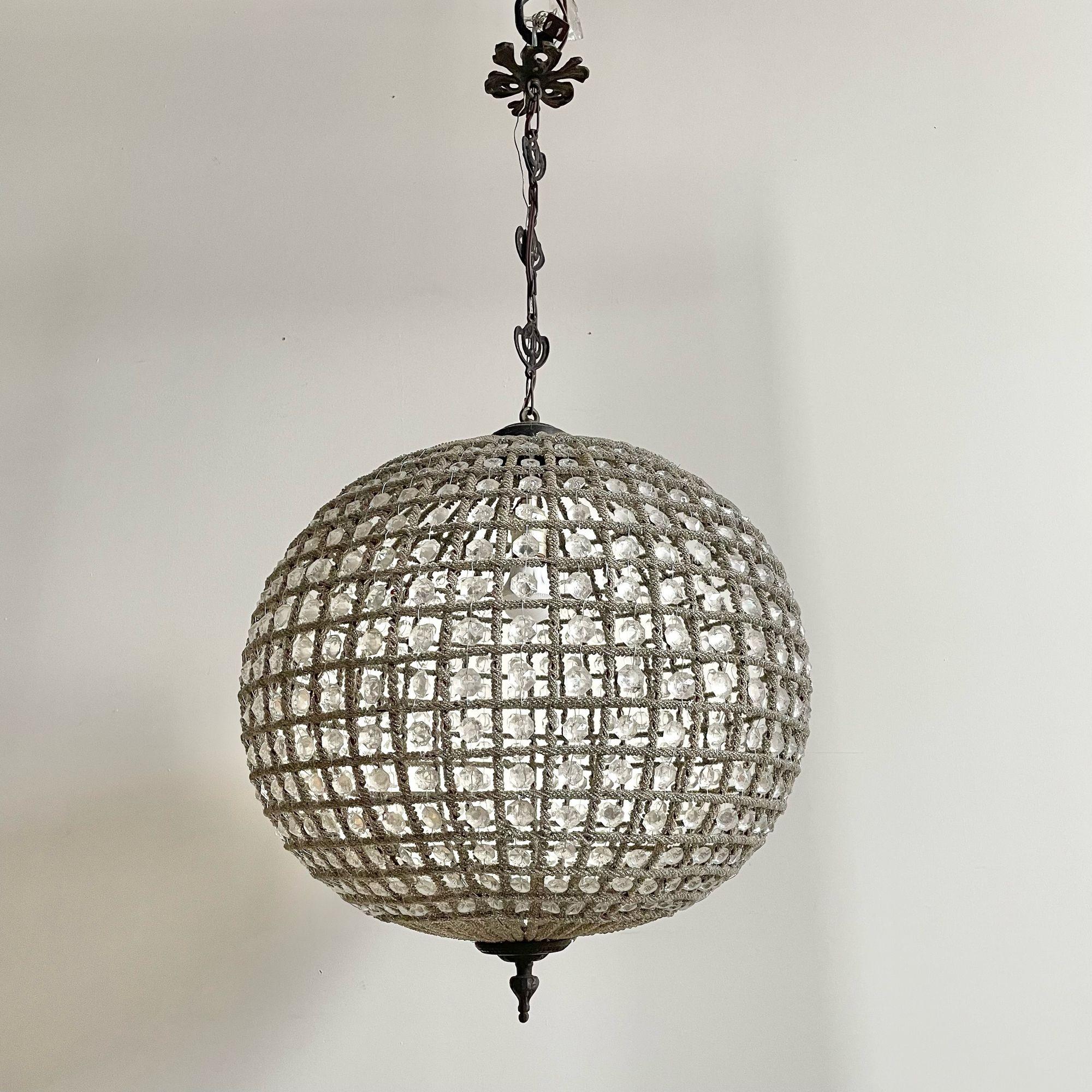 Art Deco, Round Chandeliers, Beveled Crystal, Metal, United States, 1980s

A detailed pair of circular globe mesh wired and crystal lights. Exquisite pendant chandeliers, each in round shape wired with crystals. Each having a 15