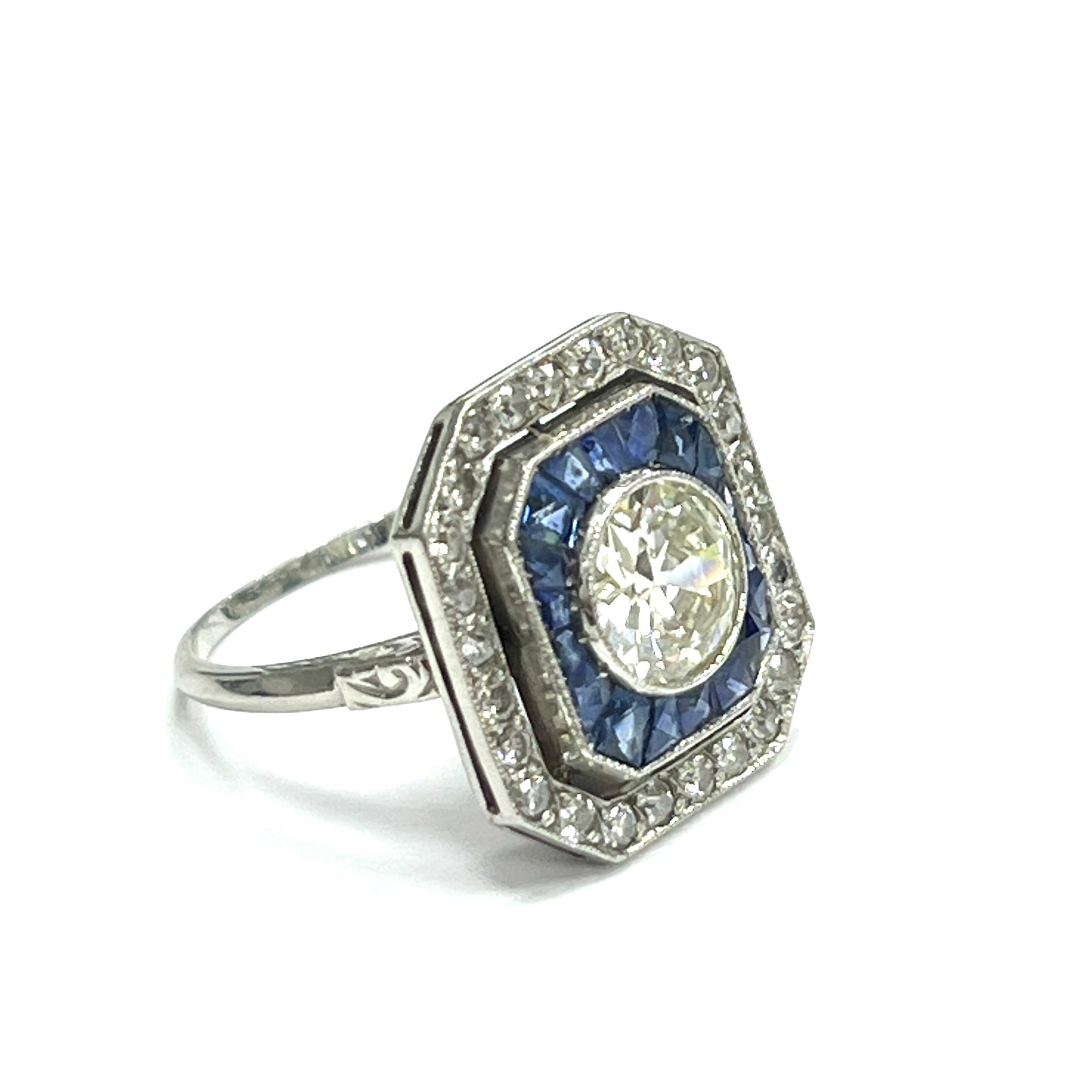 Art Deco Diamond Sapphire Ring, circa 1920s

Round-cut center stone of 1.35 carats with color J-K, clarity SI1-SI2; remaining diamonds weigh 0.50 carat; calibre-cut sapphires of 1 carat; white gold mounting. Top width 17 mm, top length 18 mm.

Size: