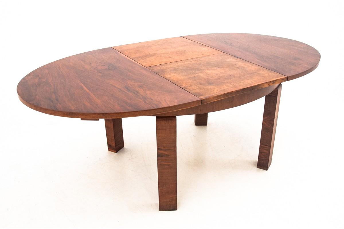 Walnut Art Deco dining table. After renovation
Comes from Poland from circa 1940s-1950s.
Beautiful unique walnut veneer.
Measures: 214 cm after unfolding wide.


 