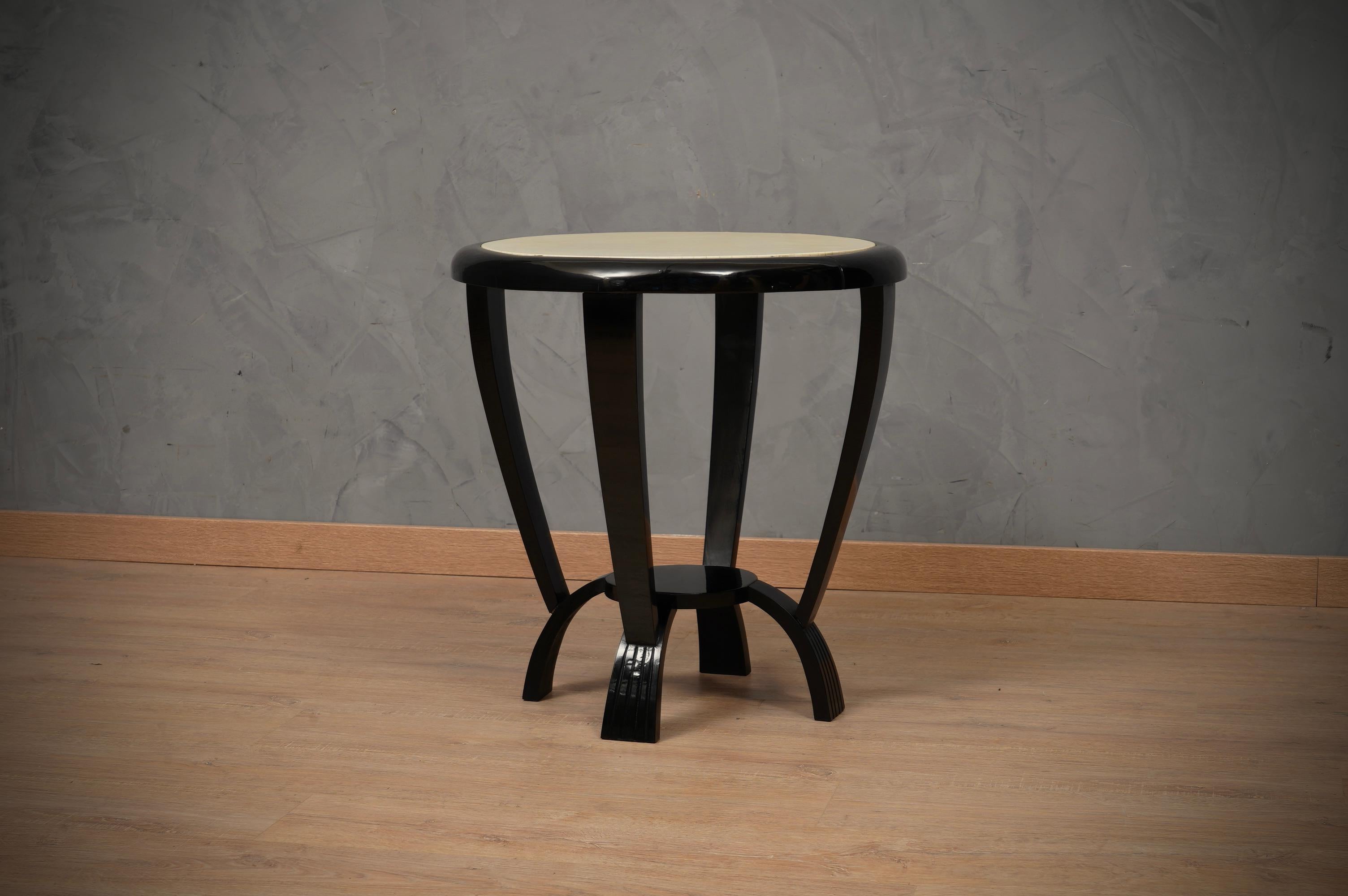 Rich design for this couple of side tables, polished with black shellac and covered with goatskin.

Top is covered in goatskin and then well-polished. A single piece of leather for the top table, even more difficult to find, very precious. The edge