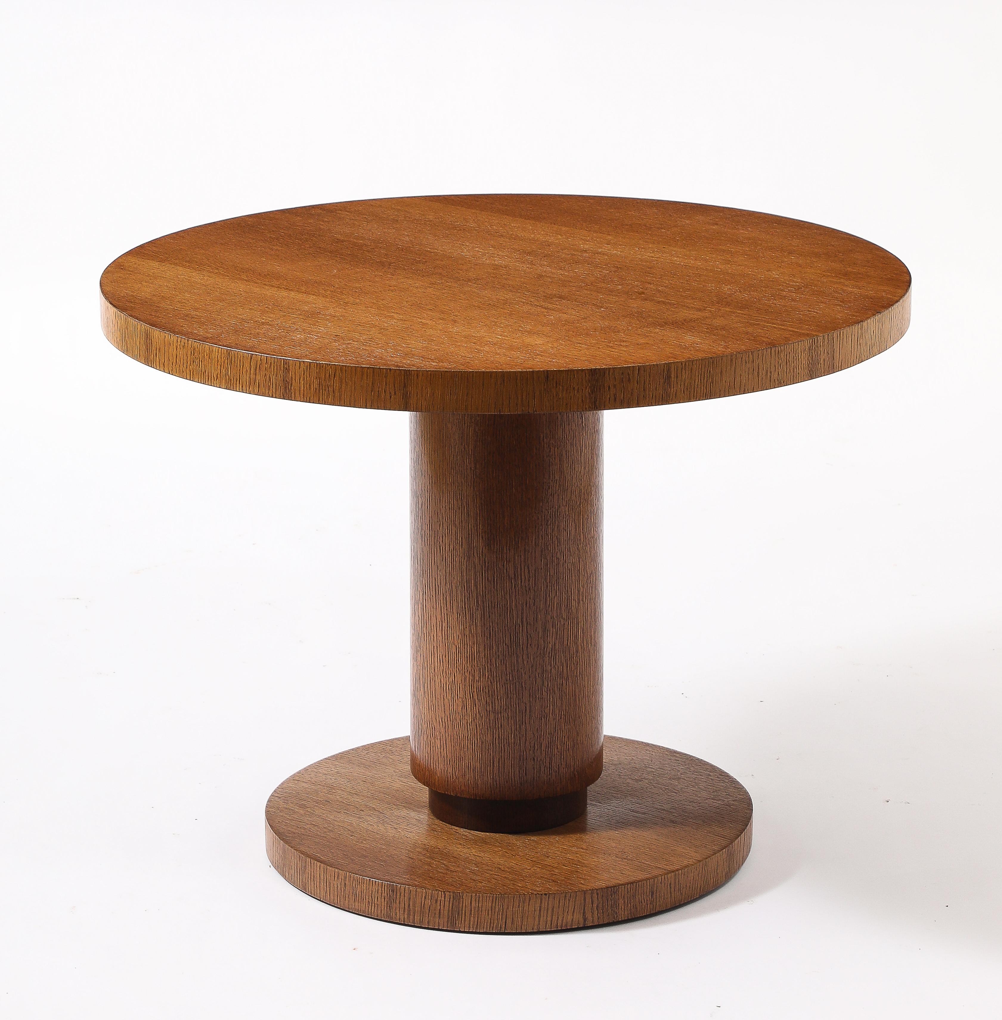 A pedestal oak table in the manner of Djo Bourgeois with a recessed detail to base, original finish.