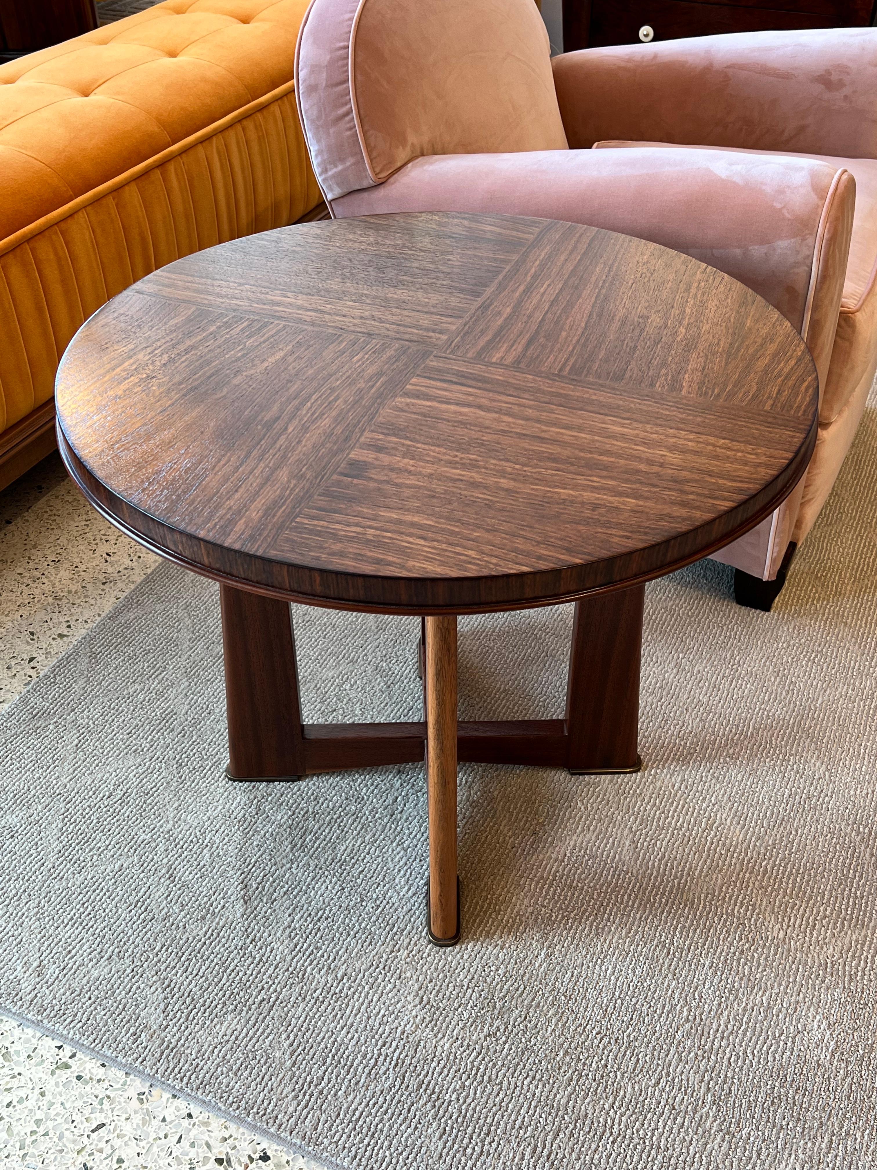 A marvelous coffee table in rosewood and bronze sabots designed by Maxime Old. 
Made in France.