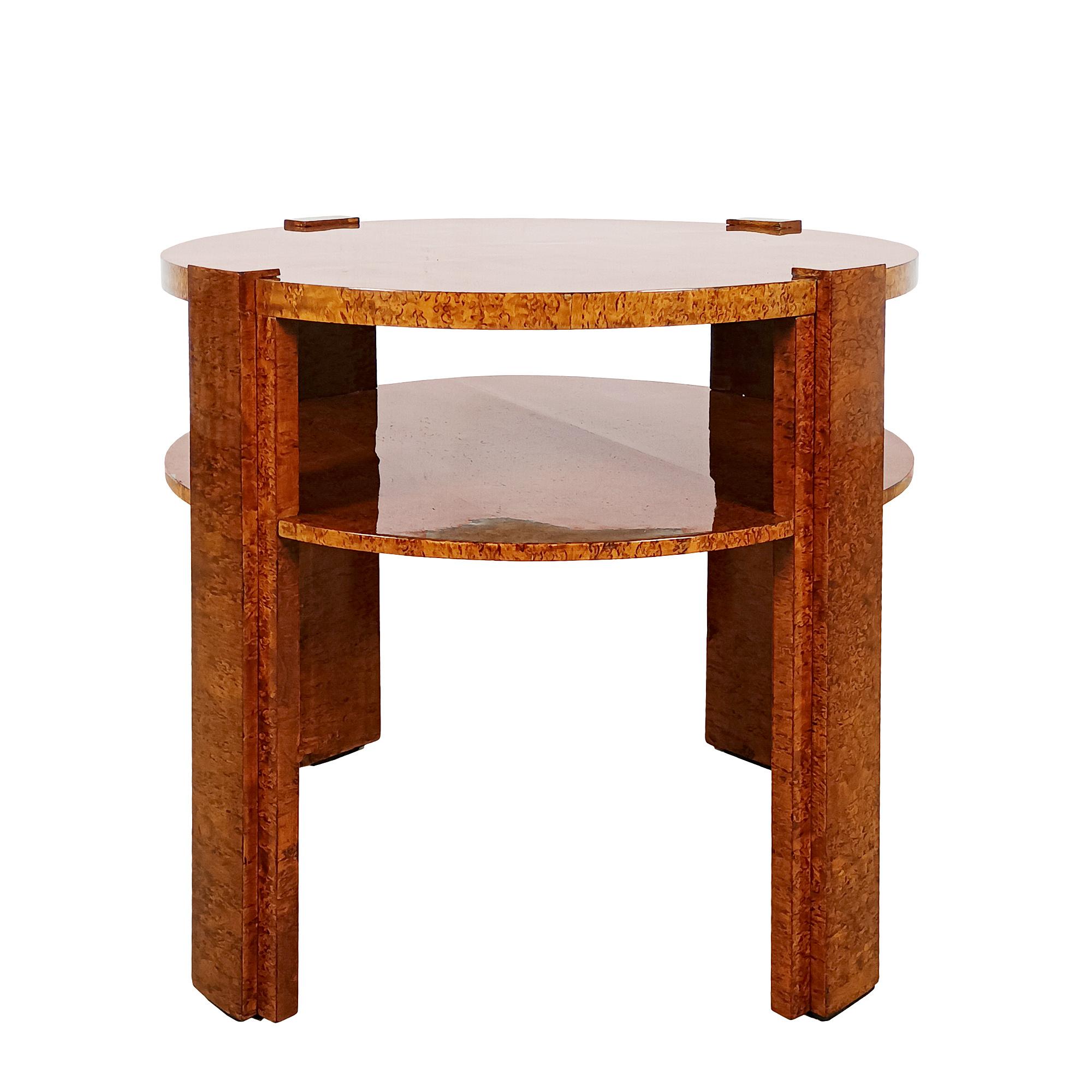 Art deco round side table with 4 cubist-style stands turning over the top. Solid wood, fully veneered with birch. French polish.
France circa 1930

Dimensions
cm Diam 65,50/68 (with stands) x 56,50/57 (stands)
inches Diam 26.18/26.77 (with stands) x