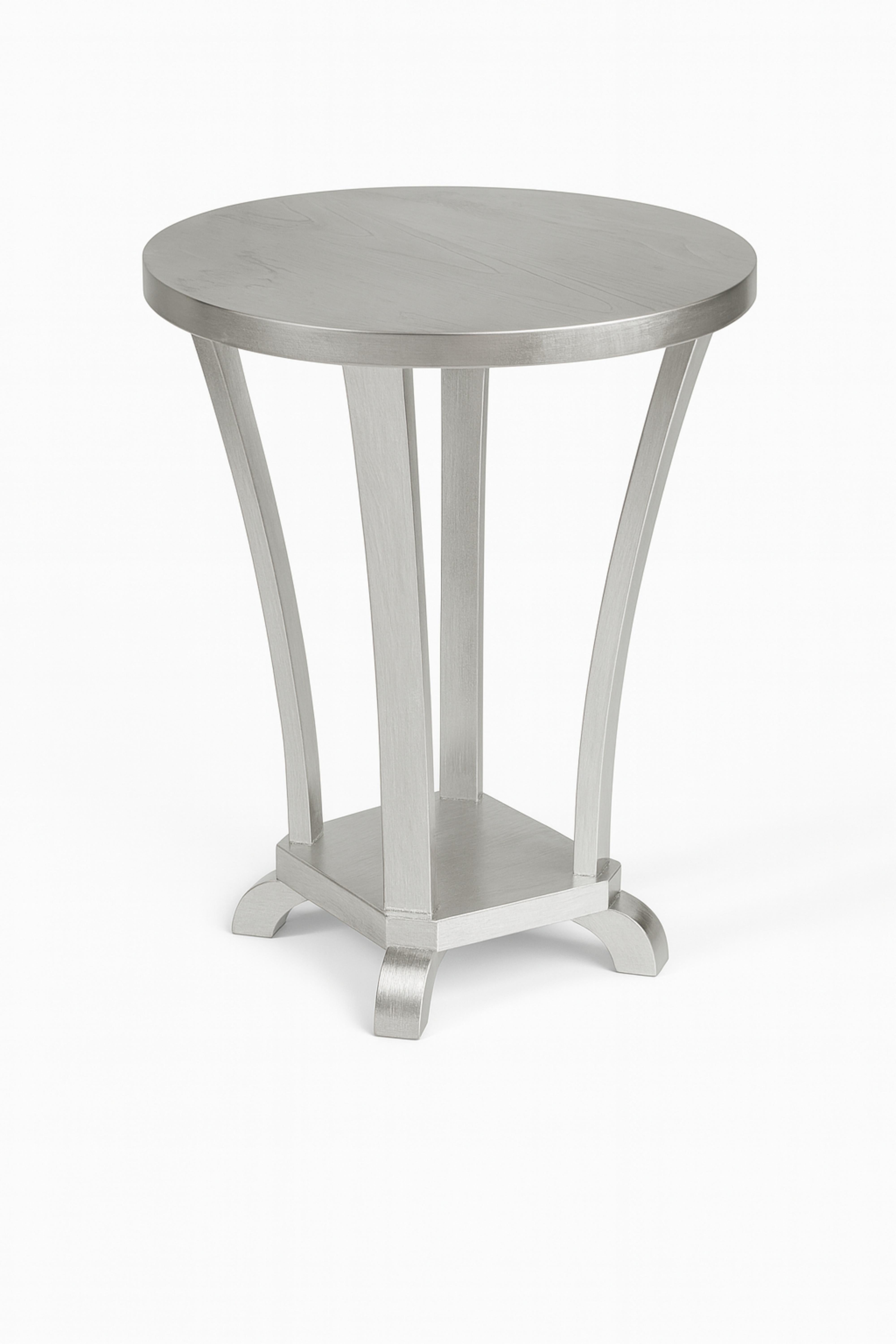 This Art Deco silver gilt chestnut side table from 1930s France was crafted with a round two-level structure, it features four gracefully curved legs connected to a circular base.

A true statement piece, this table captures the bold geometry and