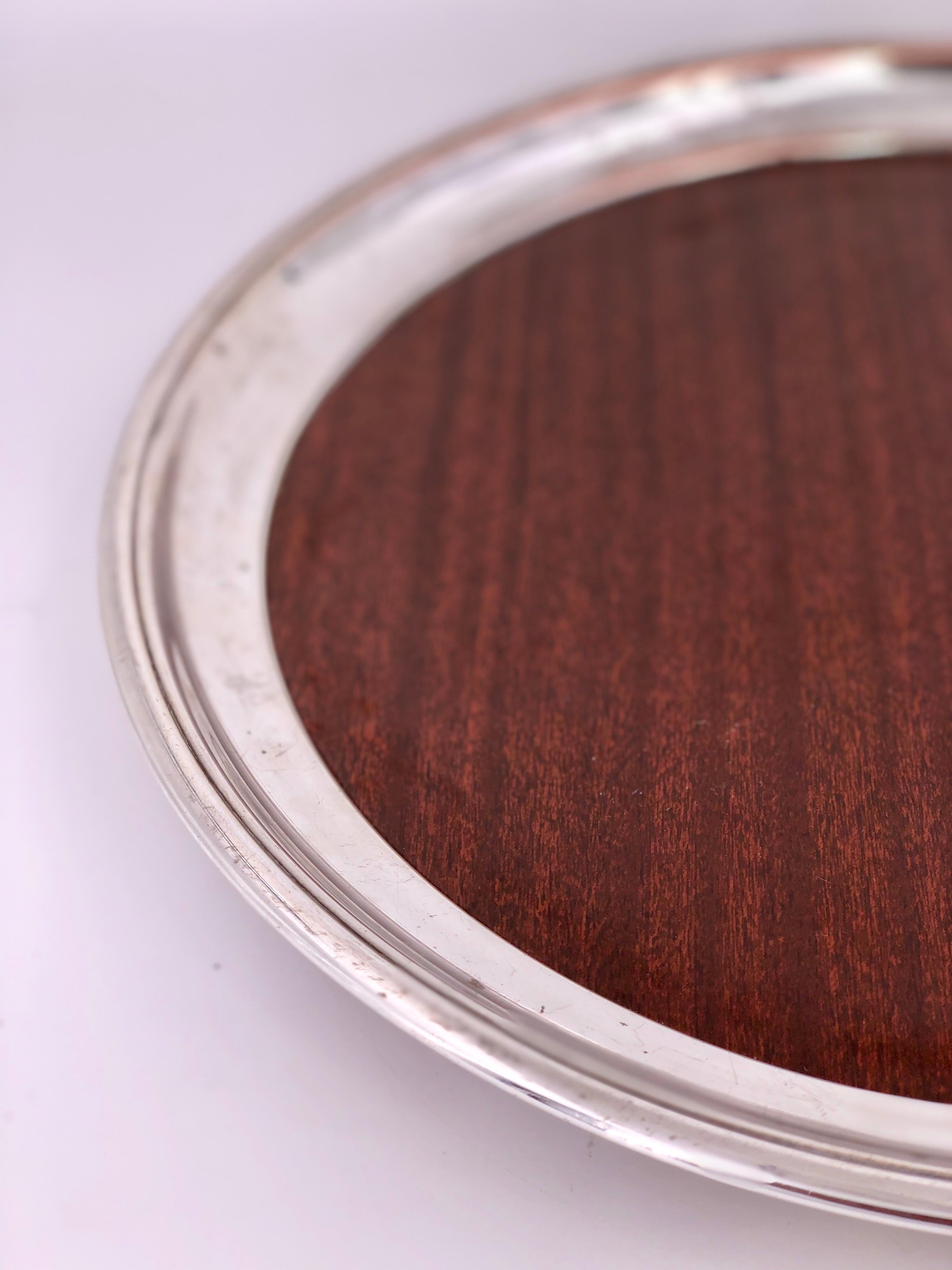 A beautiful Art Deco silver plated tray with raised edge, and faux rosewood laminate very nice and clean condition. By Crescent.