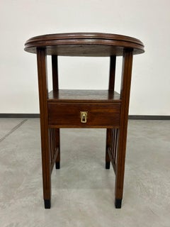 Art deco round table with brass top