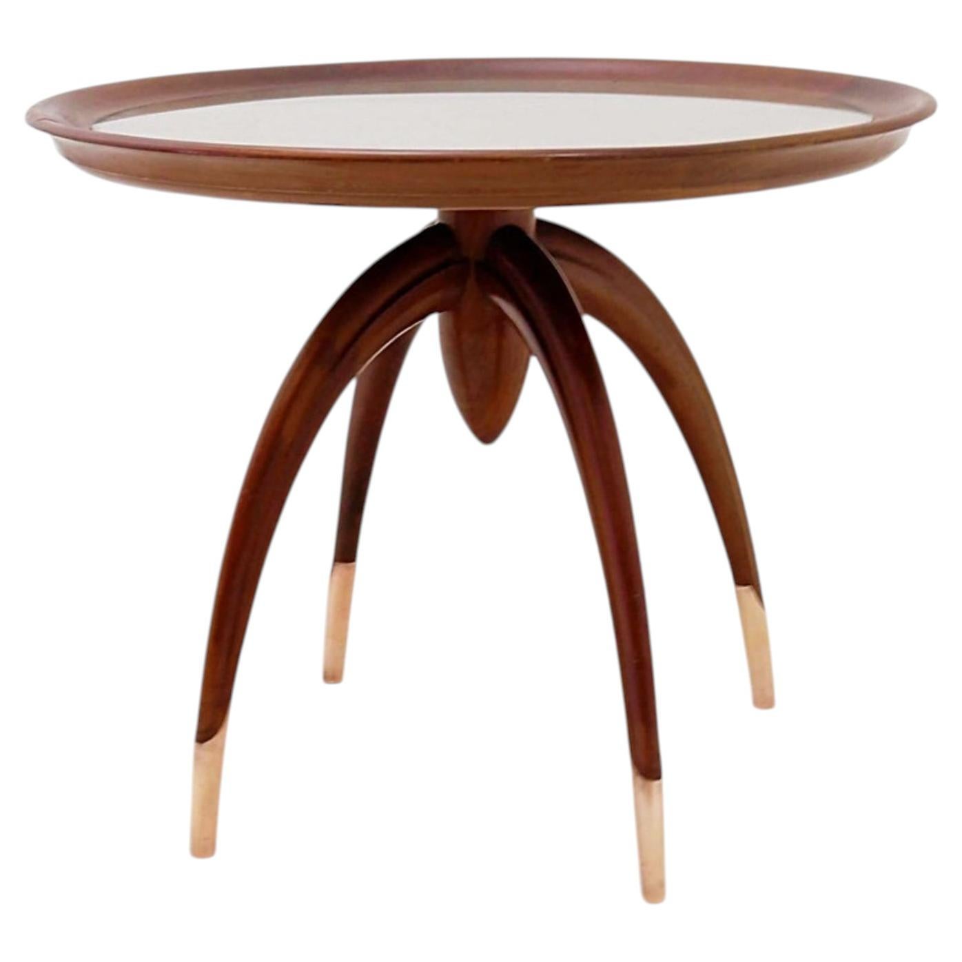 Art Deco round wooden side table with curved legs and brass feet For Sale