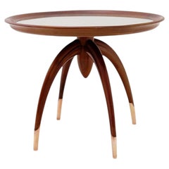 Art Deco round wooden side table with curved legs and brass feet