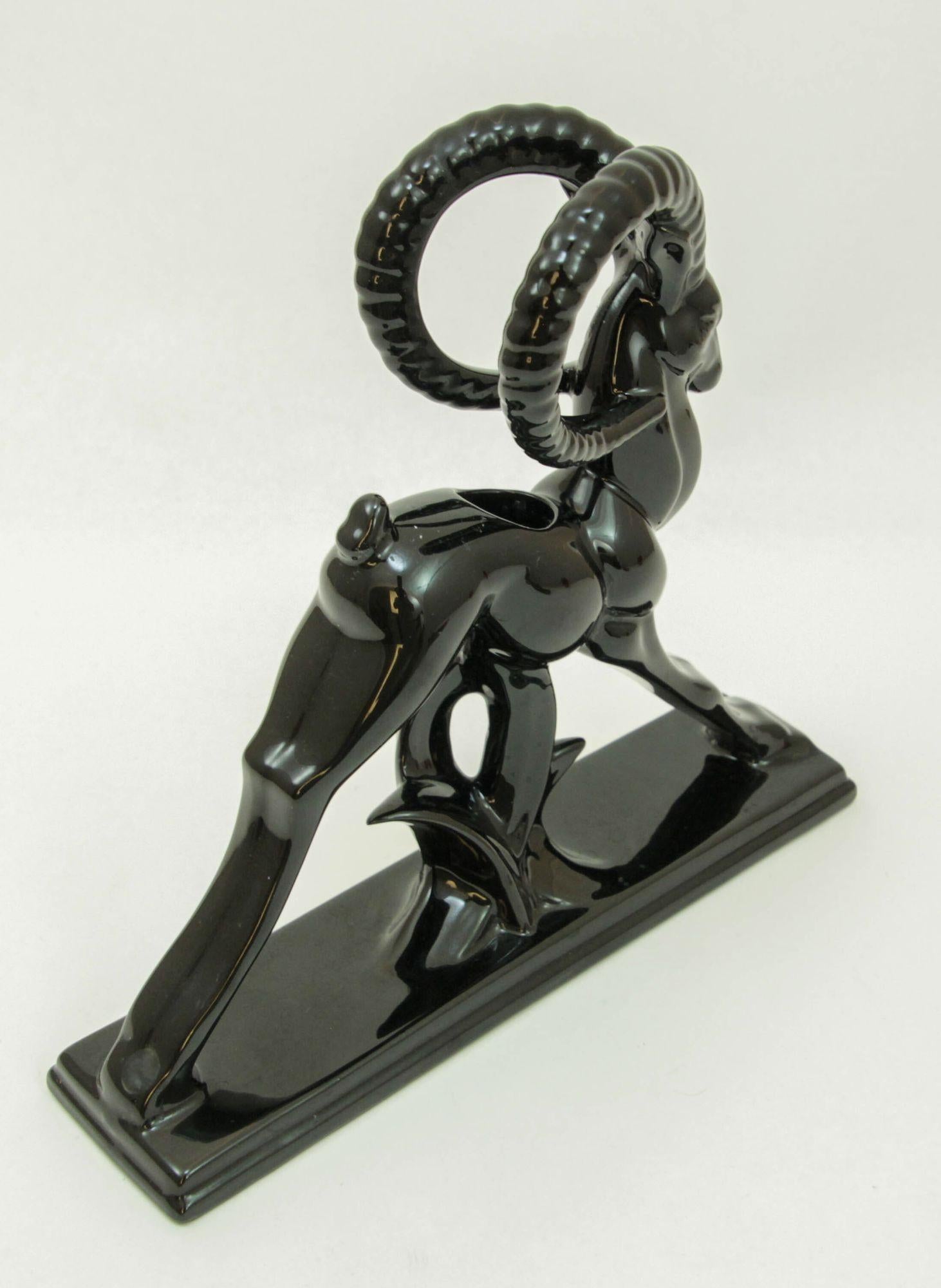 Beautiful vintage Royal Haeger style ceramic sculptural ram ibex done in the Art Deco style.
Done in high gloss black glazed ceramic with a hole on top to use as a small planter vase or candle holder.
Art Deco Candle Holder Black Gazelle
Dimensions:
