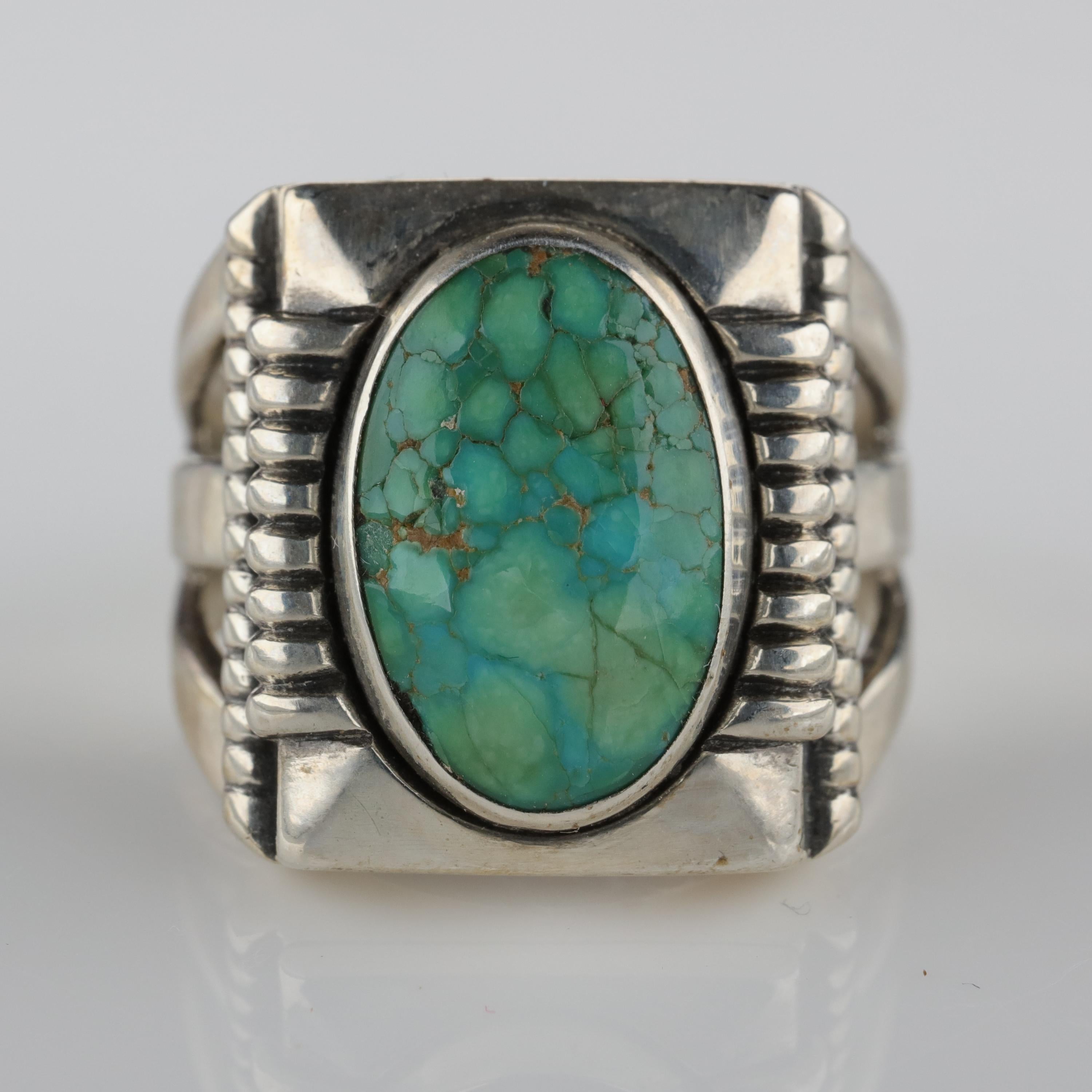 This is one of the more unusual —and beautiful— turquoise and silver rings I have taken into my possession. This circa 1930s Art Deco ring is defined by its strong, graphic lines and elegant tailoring. This exceptionally well-crafted ring holds a
