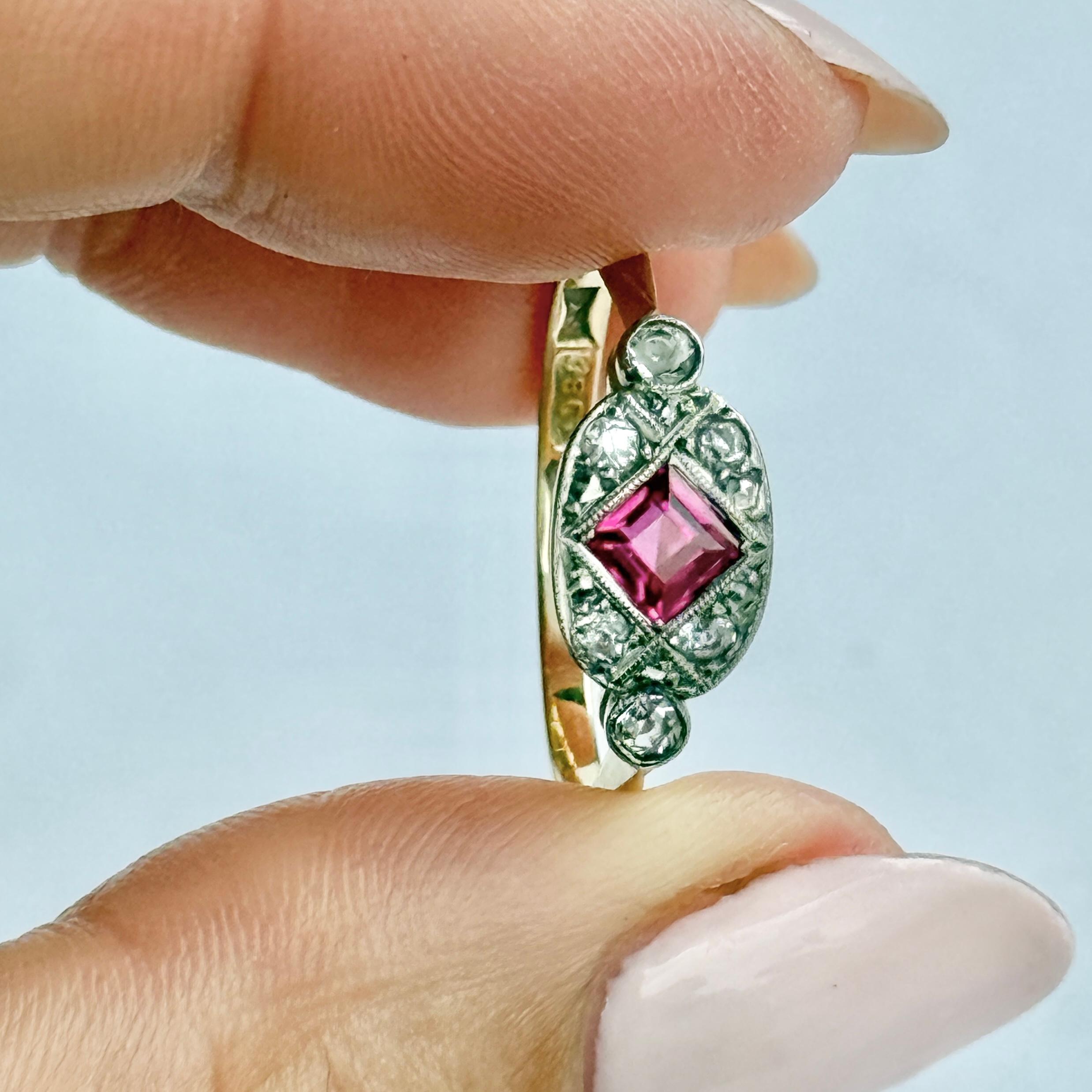 This gorgeous panel style ring holds a 30pt pink ruby and there are also diamonds. The diamond total of this ring is 14pts and all the stones are set in platinum. 

Size: Q or 8 
Face Width: 15x7mm
Height Off Finger: 3mm

Weight: 2.9g