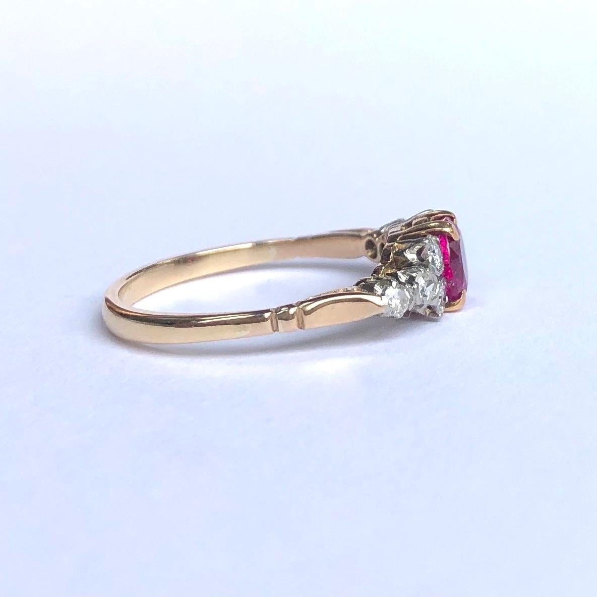 The central ruby in this ring is absolutely stunning. It is bright pink in colour and measures approx 60pts and either side of it are four smaller diamonds each measuring 5pts each. The stones are set in platinum and the rest of the ring is modelled