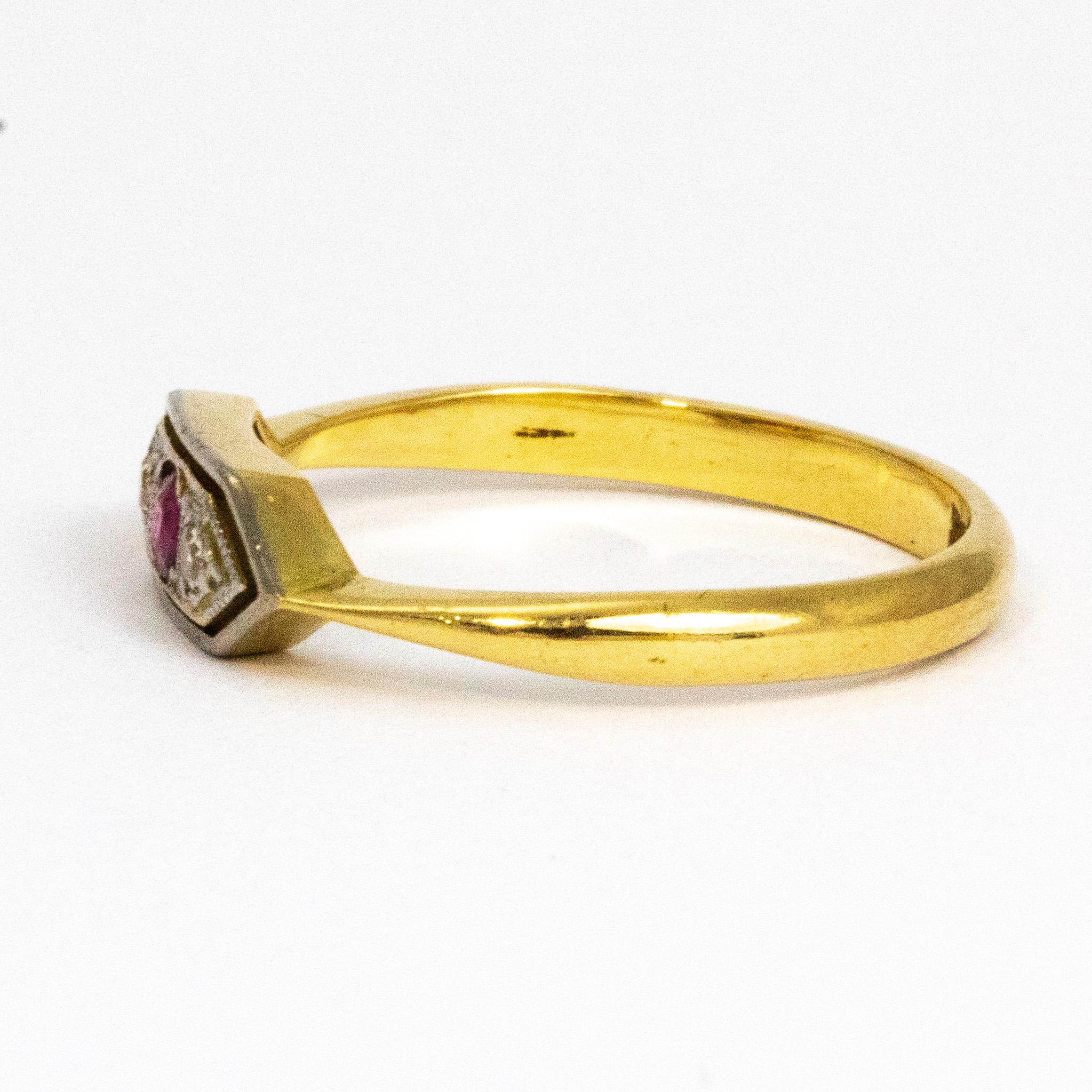 This gorgeous ruby and diamond beauty boasts a 7pt ruby and two 3pt diamonds that are set in platinum. The setting is classically deco style with wonderful line details and crisp edges. The band is modelled out of 18ct gold and is hallmarked.

Ring