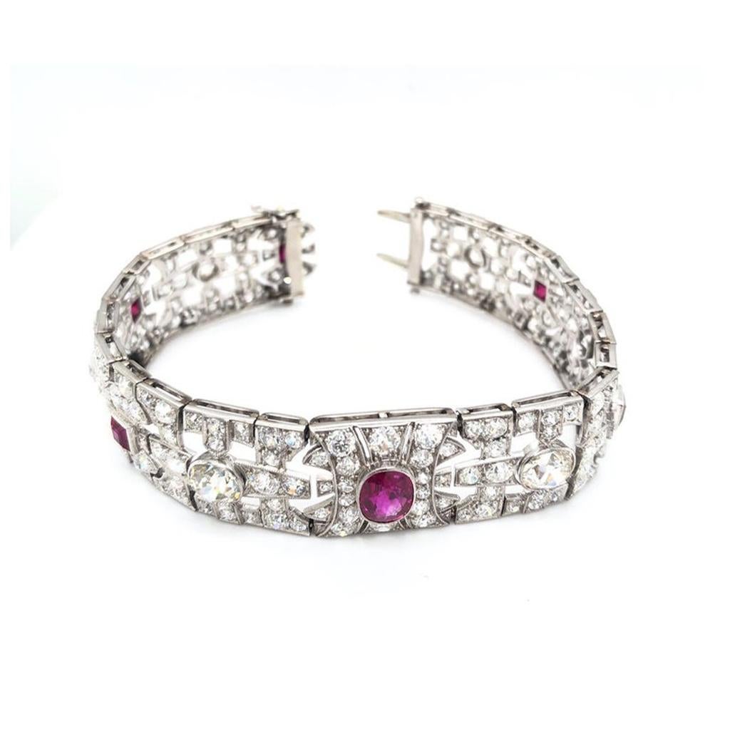 Art Deco Ruby and Diamond Bracelet. This estate diamond and ruby bracelet is set in platinum and dated to approximately 1925. There are 5 square rubies and 1 oval ruby totaling approximately 4.3cts and a total of approximately 18cttw of diamonds.