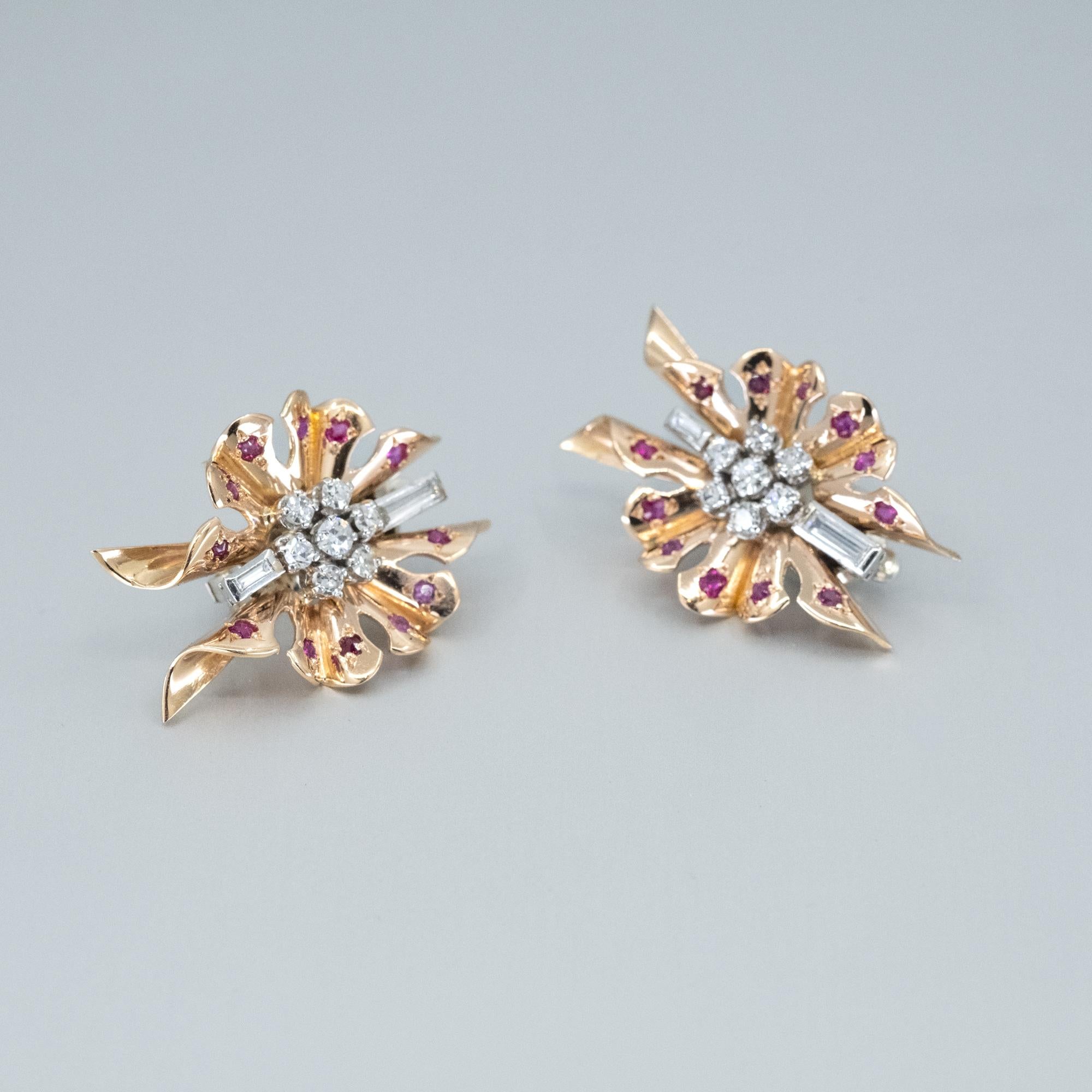 An Art Deco Diamond and Ruby pair of clip-on earrings.

The diamond and ruby earrings are in the shape of a butterfly and are set with natural rubies in the wings and round and baguette cut diamonds.
All set in 18ct yellow and white gold.
French