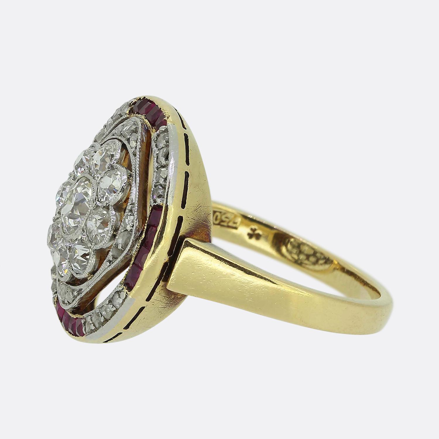Here we have a marvellous ruby and diamond cluster ring crafted during the pinnacle of the Art Deco movement. A daisy cluster consisting of round faceted old European cut diamonds sits at the centre of an open face which is contained, firstly, by a