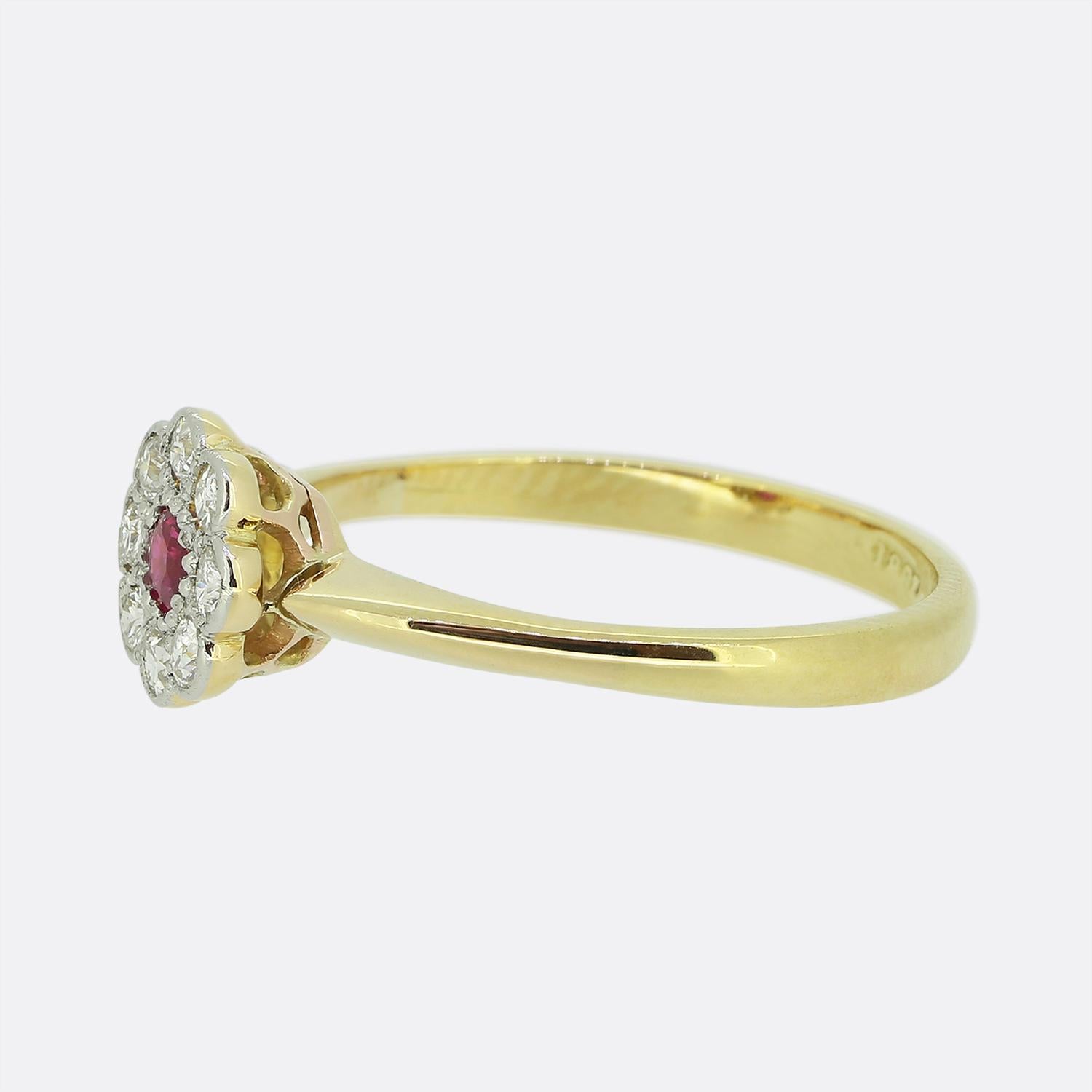 A wonderfully elegant ruby and diamond cluster ring dating back to the early 20th century. The centre of the ring features a rich red ruby which is surrounded by eight sparkling round diamonds, in a daisy style. It is crafted in 18ct yellow gold