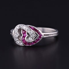 Art Deco Ruby and Diamond Entwined Hearts Ring of Platinum