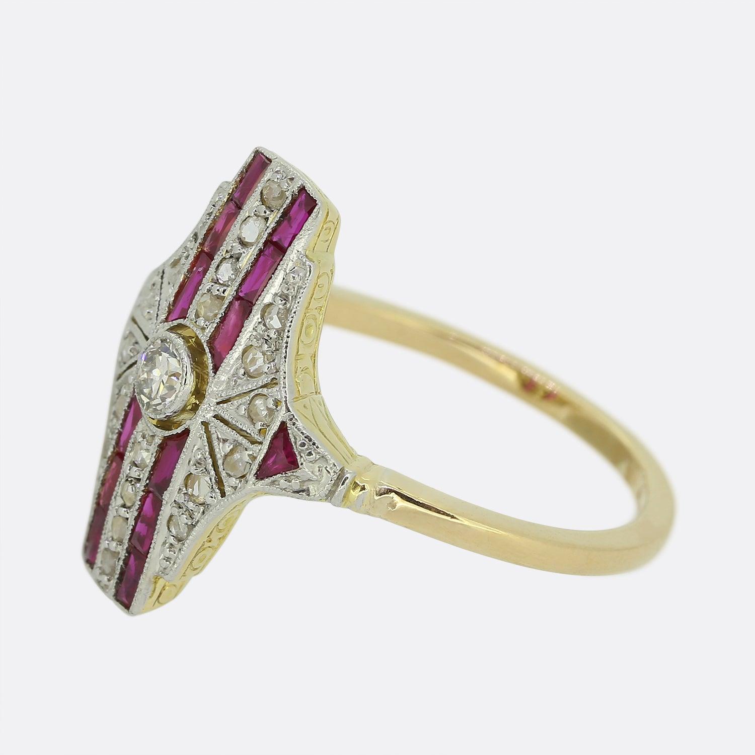 Here we have a beautifully crafted Art Deco plaque ring. A single round faceted old cut diamond sits slightly risen at the centre of the face in a fine milgrain setting. This detailing is consistent throughout the entirety of the face including the