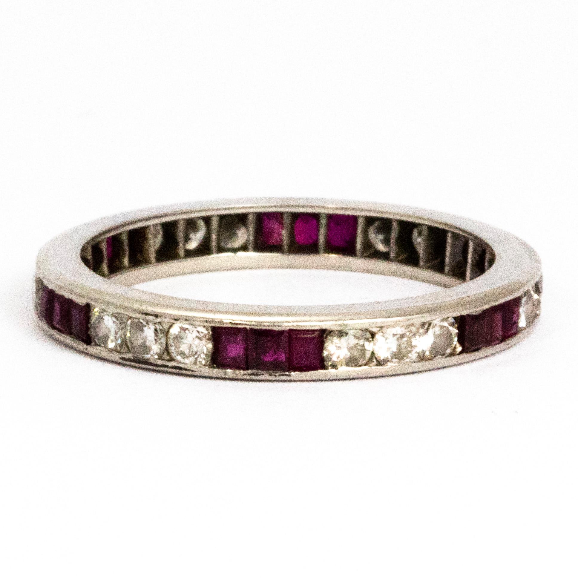 The gorgeous round cut diamonds measuring 5pts in this ring are perfectly complemented by the 10pt step cut rubies. The different colour and cut of stones make a really striking pattern on this full eternity band. 

Ring Size: R 1/2 or 8 3/4 